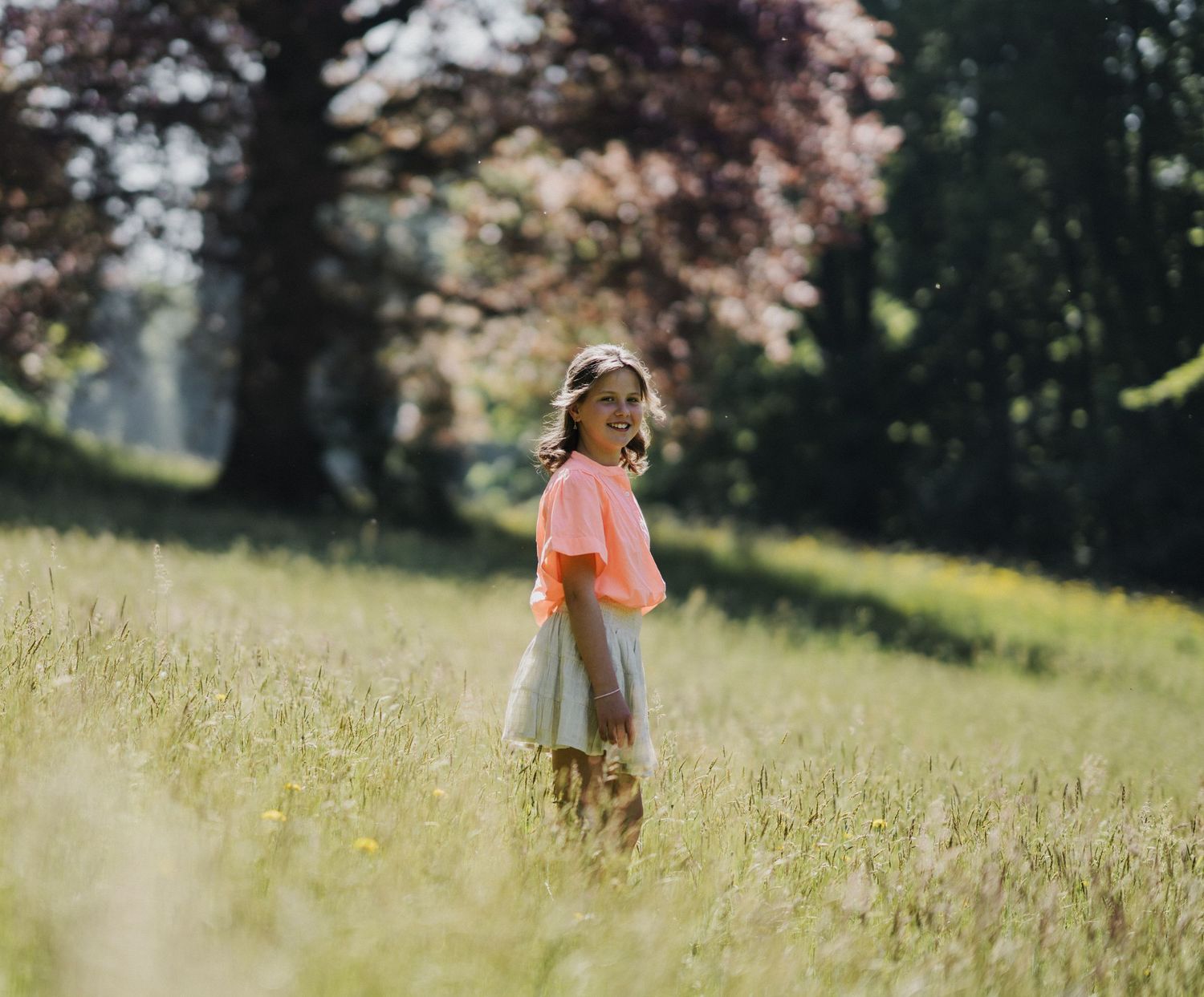 Dreamy outdoor photography series in a sun-drenched meadow.