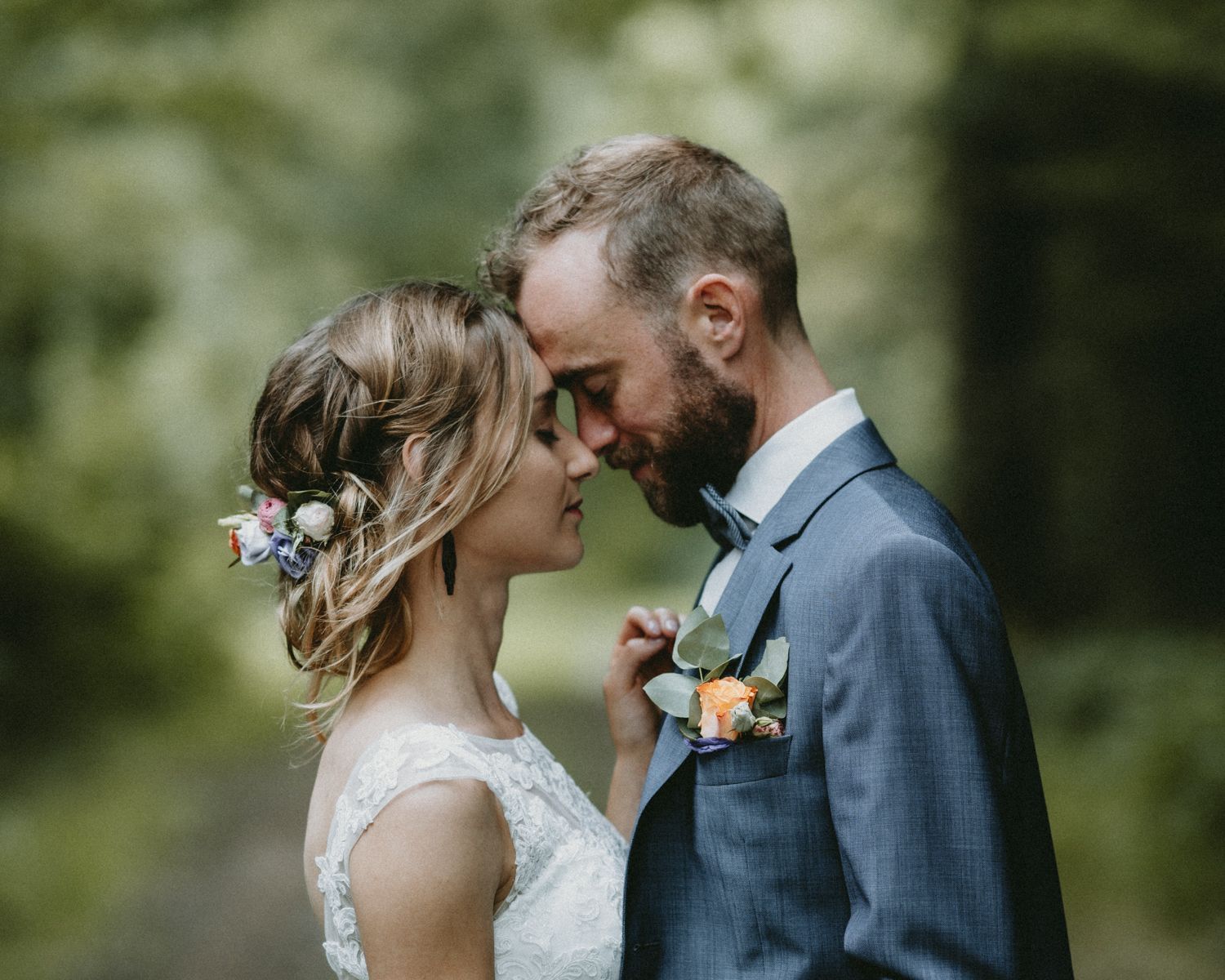 Tender outdoor wedding portraits showing couples in intimate moments against natural backgrounds.