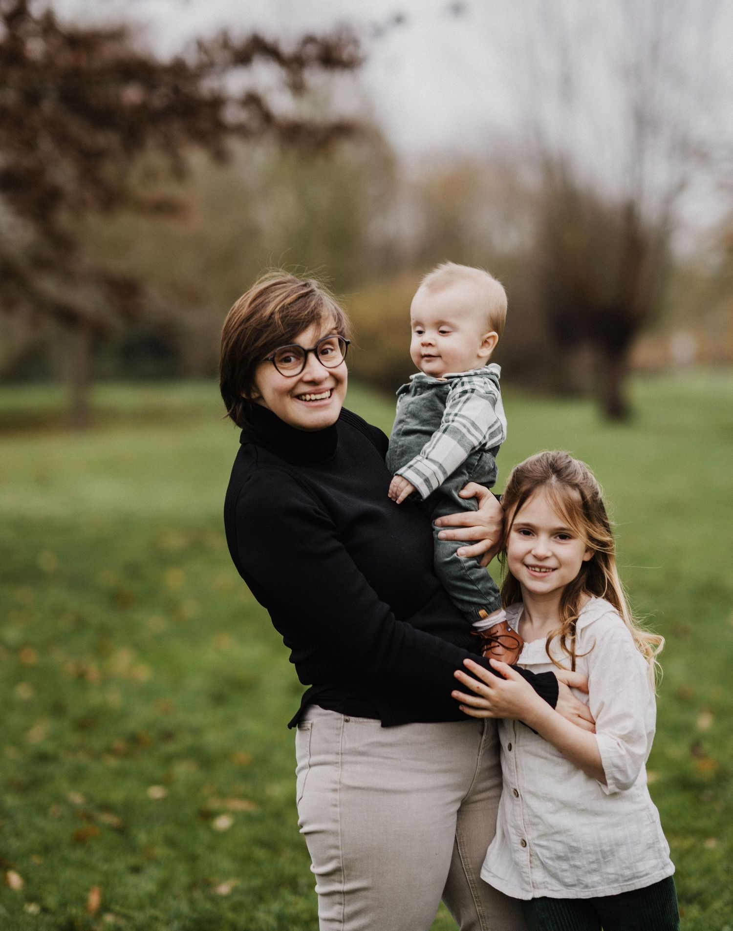 Candid family moments captured outdoors during autumn photo session.
