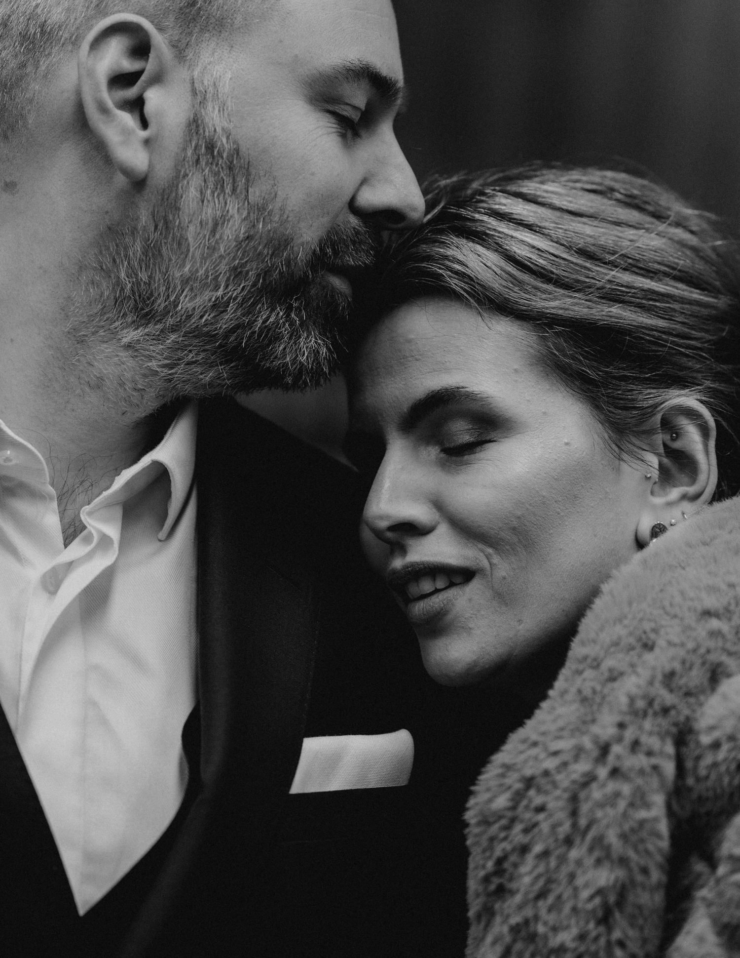 Intimate black and white close-up portraits showing tender moments between newlyweds.