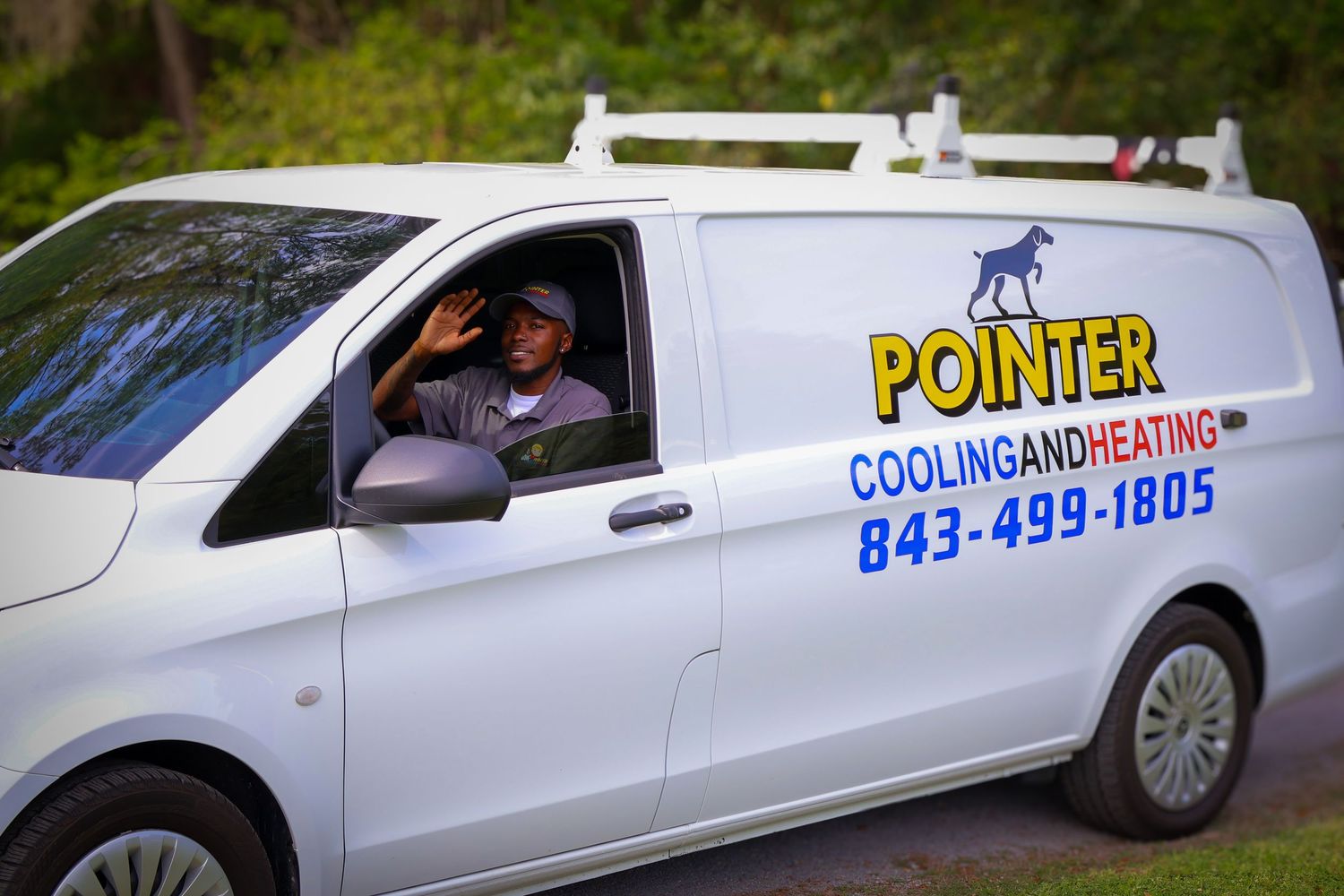 Branded service vehicles displaying Pointer Cooling and Heating company logos.