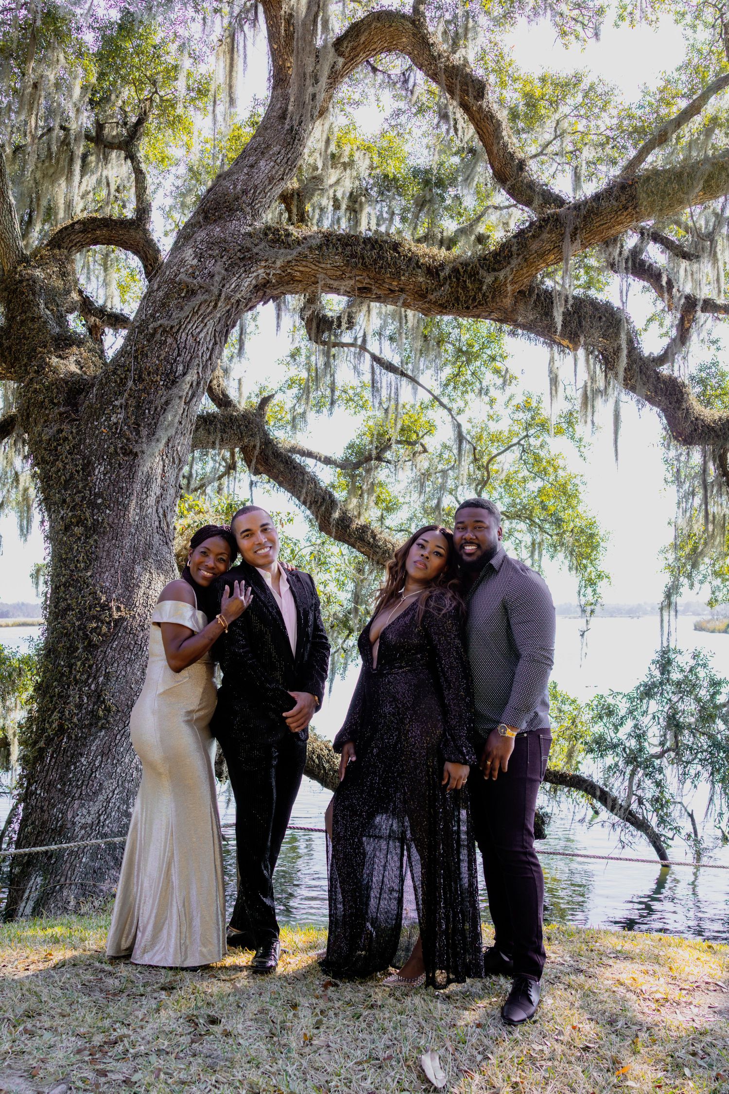 Candid group photos of wedding party members under a Spanish moss-draped tree.
