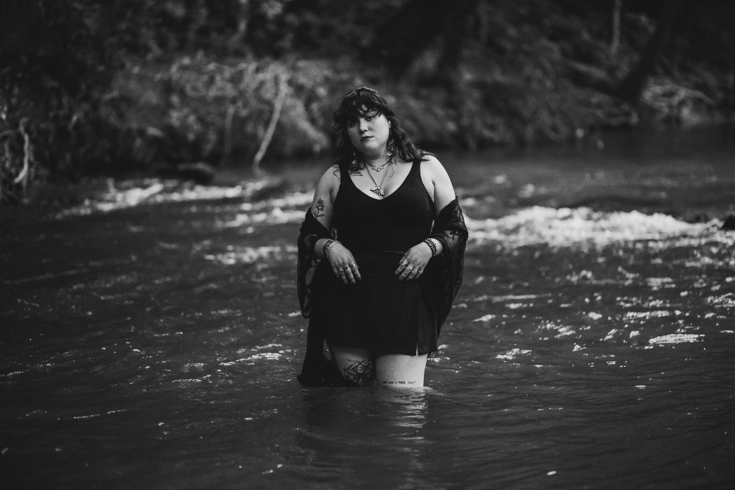 Empowering creek boudoir session highlighting natural beauty and body confidence for curvy women