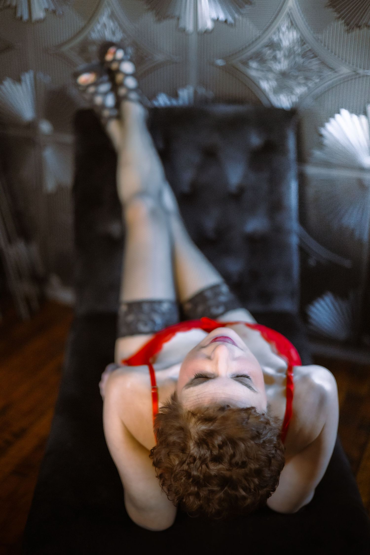 Intimate boudoir pose with dramatic shadows — classic sensual portrait in York PA studio