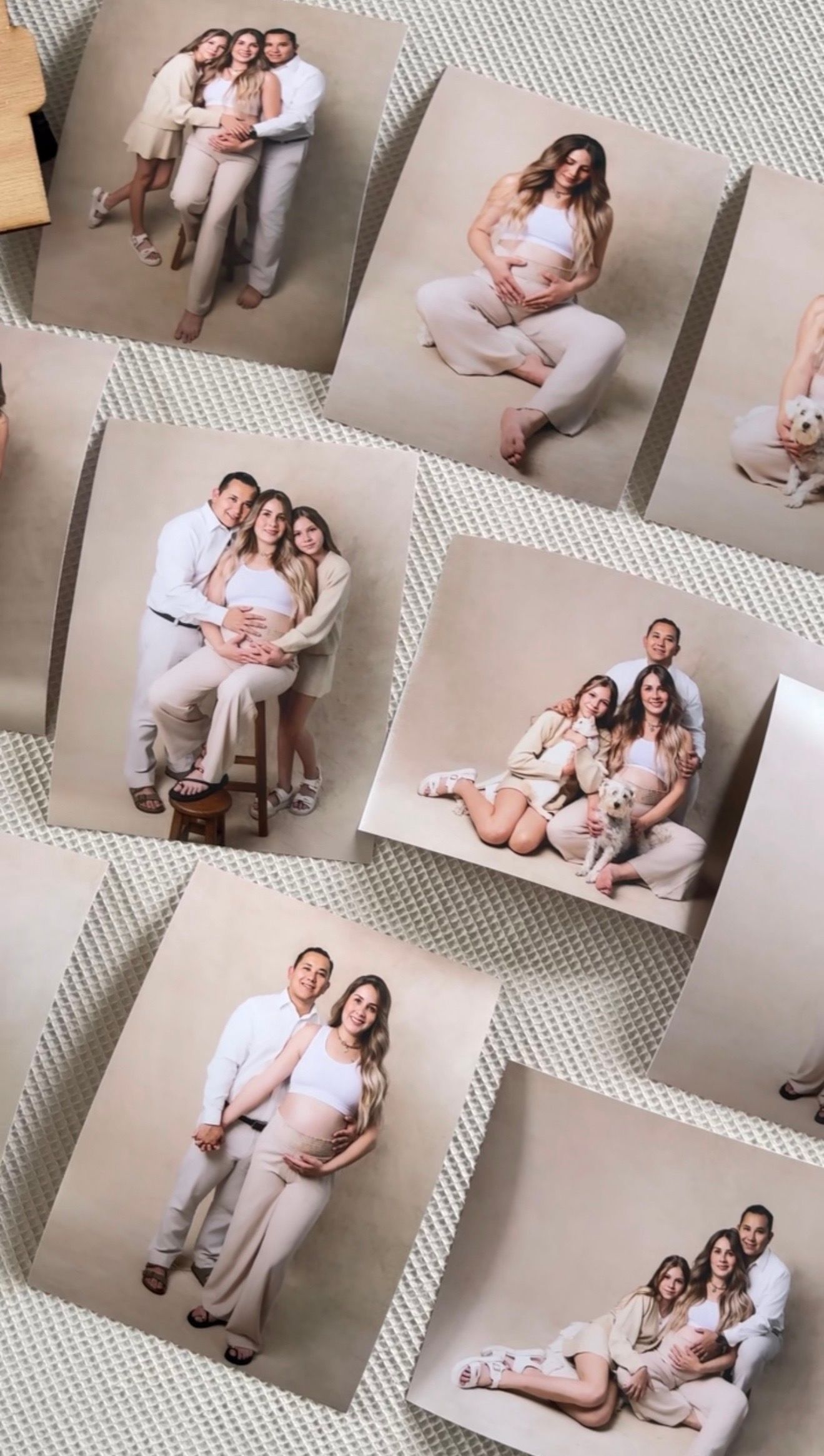 Collage of maternity photo prints featuring couple in neutral tones arranged on textured surface.