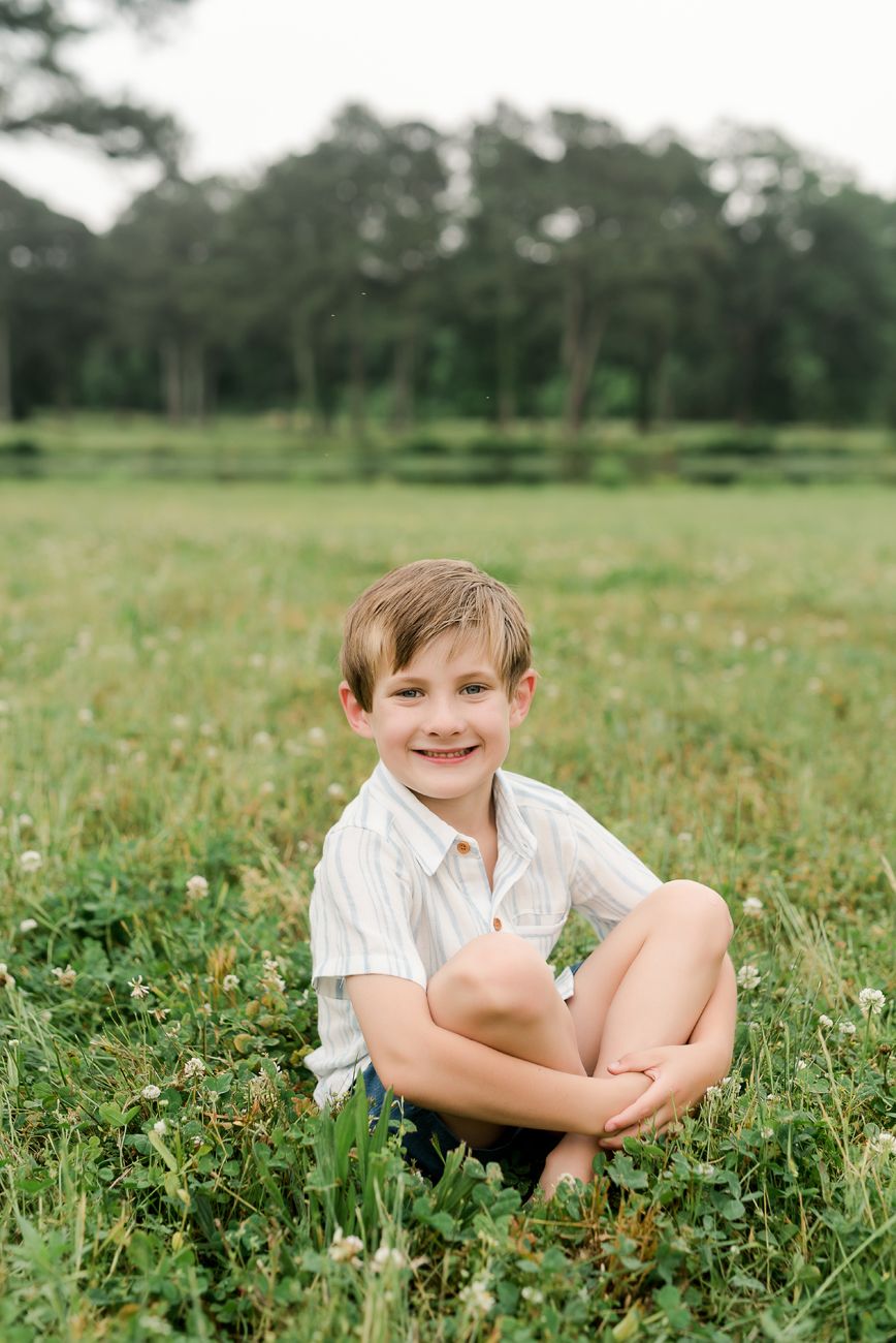 boy sitting in grass birmingham alabama