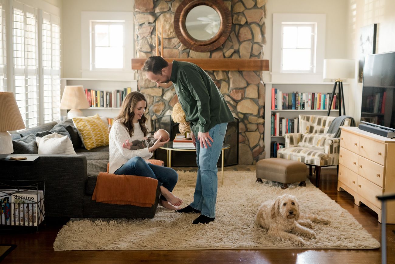 Interior shots of a cozy living room with stone fireplace and built-in bookshelves.