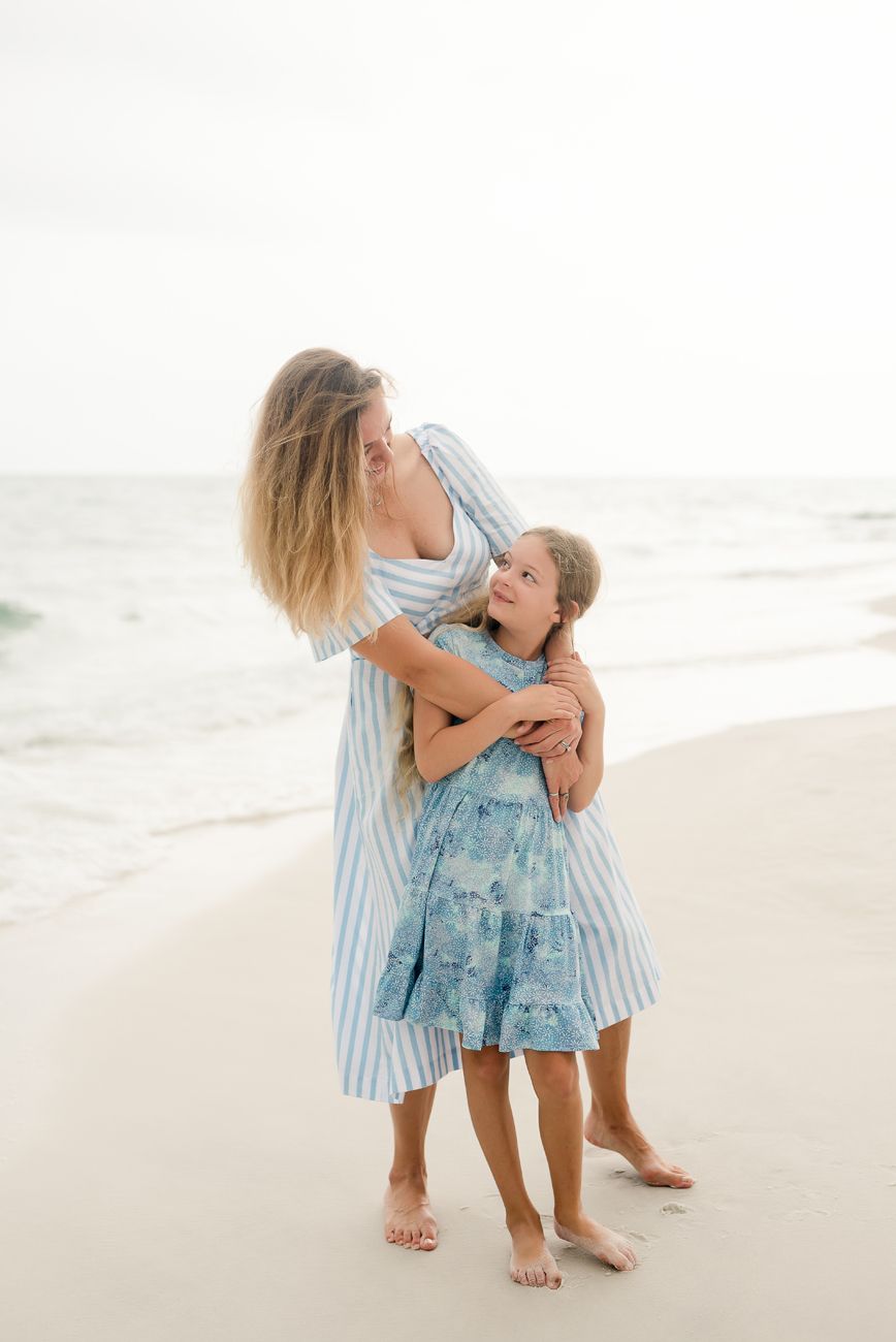 mother and daughter on beach family photos 30a