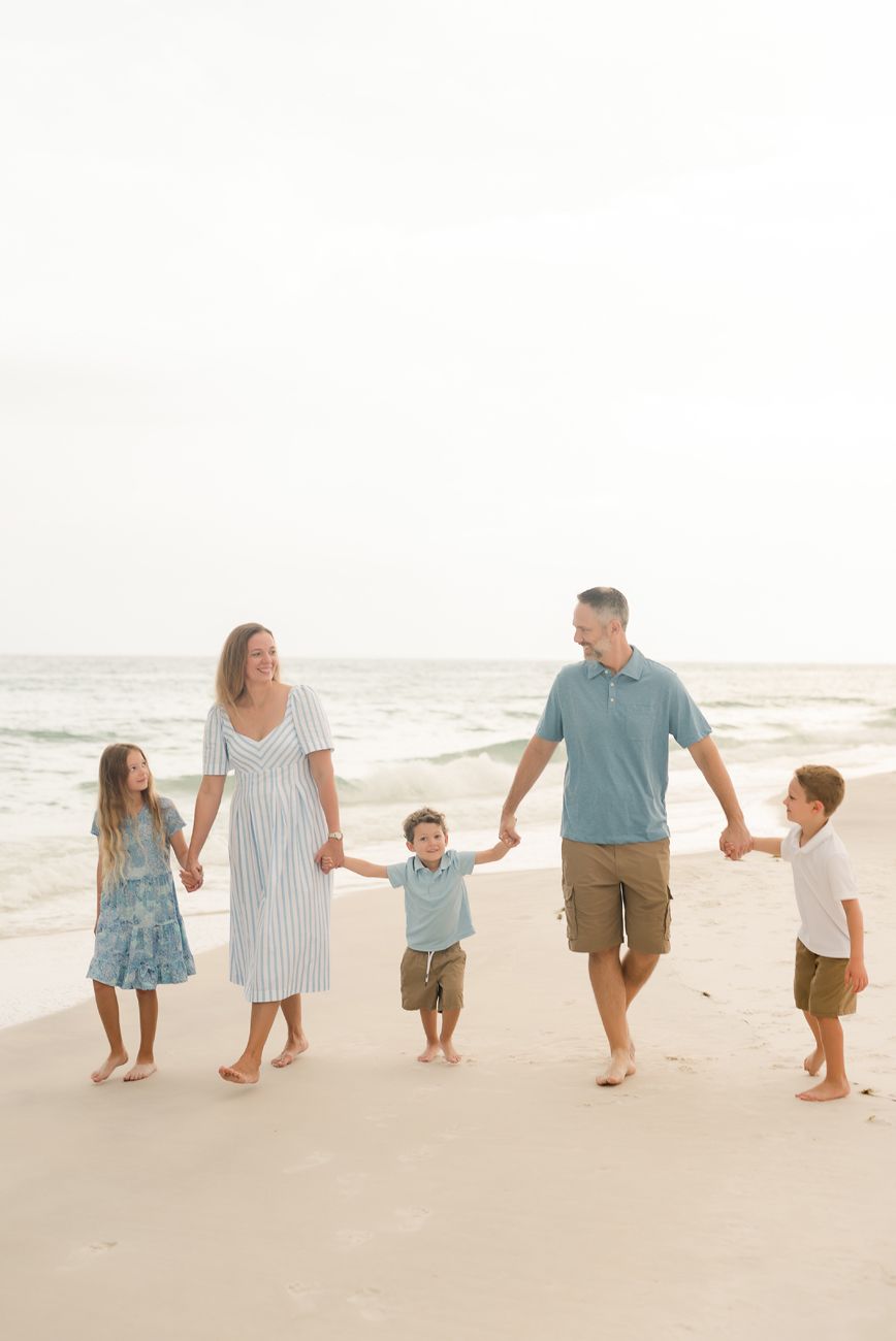 family holding hands on beach santa rosa fl