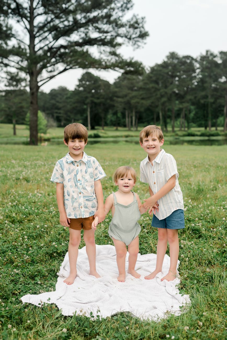 brothers holding hands in grass birmingham al