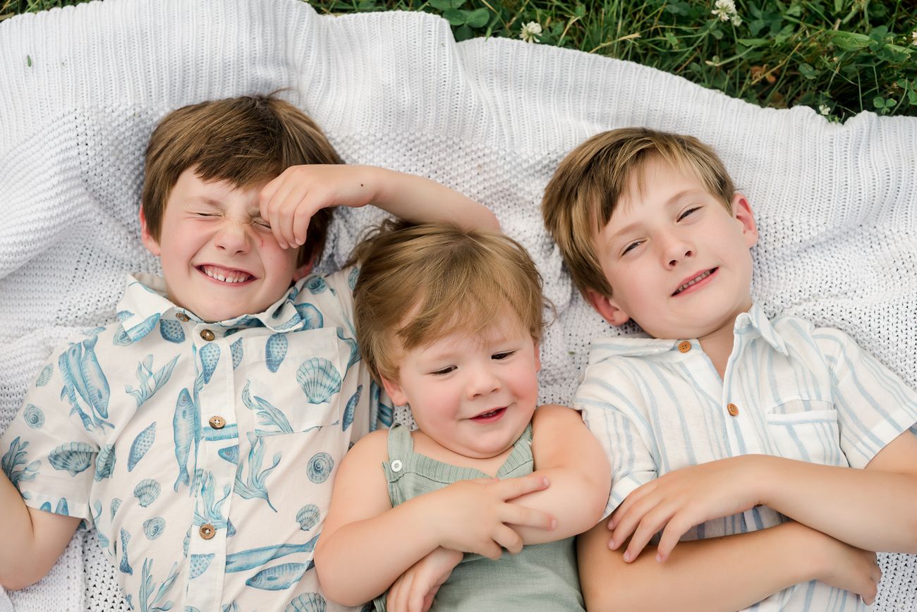 brothers laying in grass on blanket birmingham al