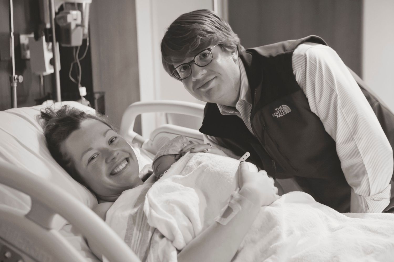 A heartwarming moment between a patient and caregiver in a hospital room.