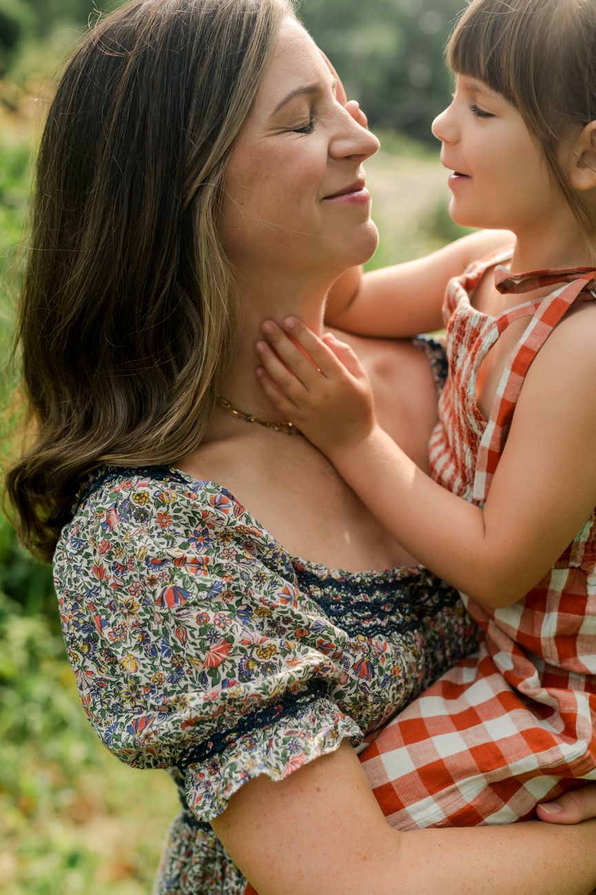 Intimate outdoor portraits featuring floral and gingham patterns in warm evening light.