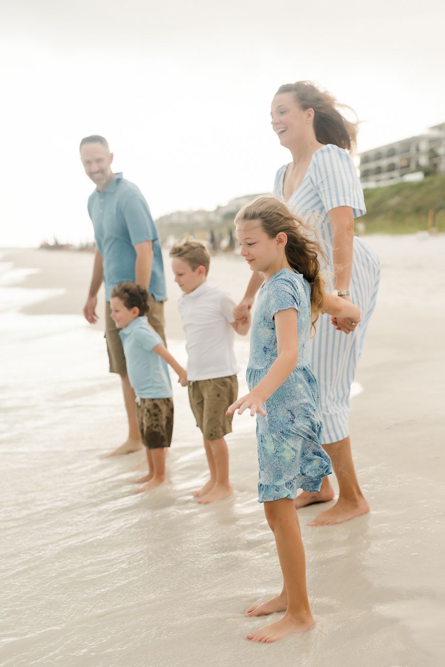 family holding hands by the ocean santa rosa fl