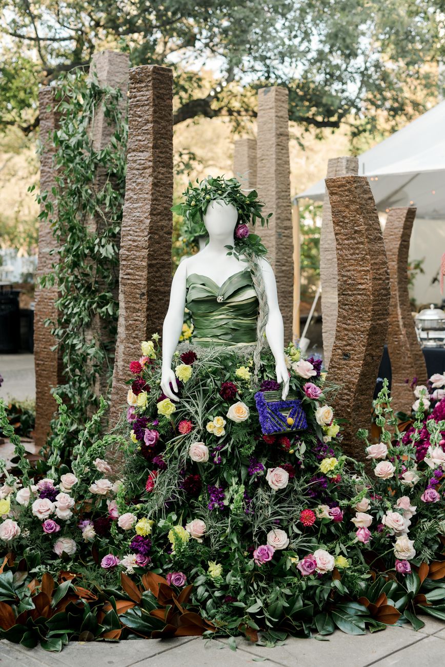 Lush floral arrangements with colorful blooms decorating an outdoor event space.