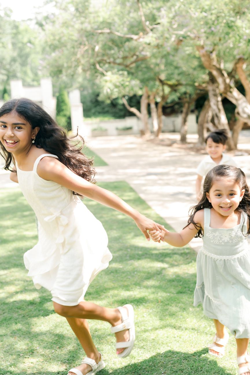 Sequence showing energetic jumping and playing in a sunny outdoor setting.