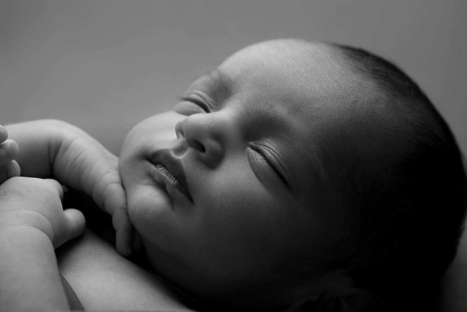 Black and white artistic close-up newborn photography series.