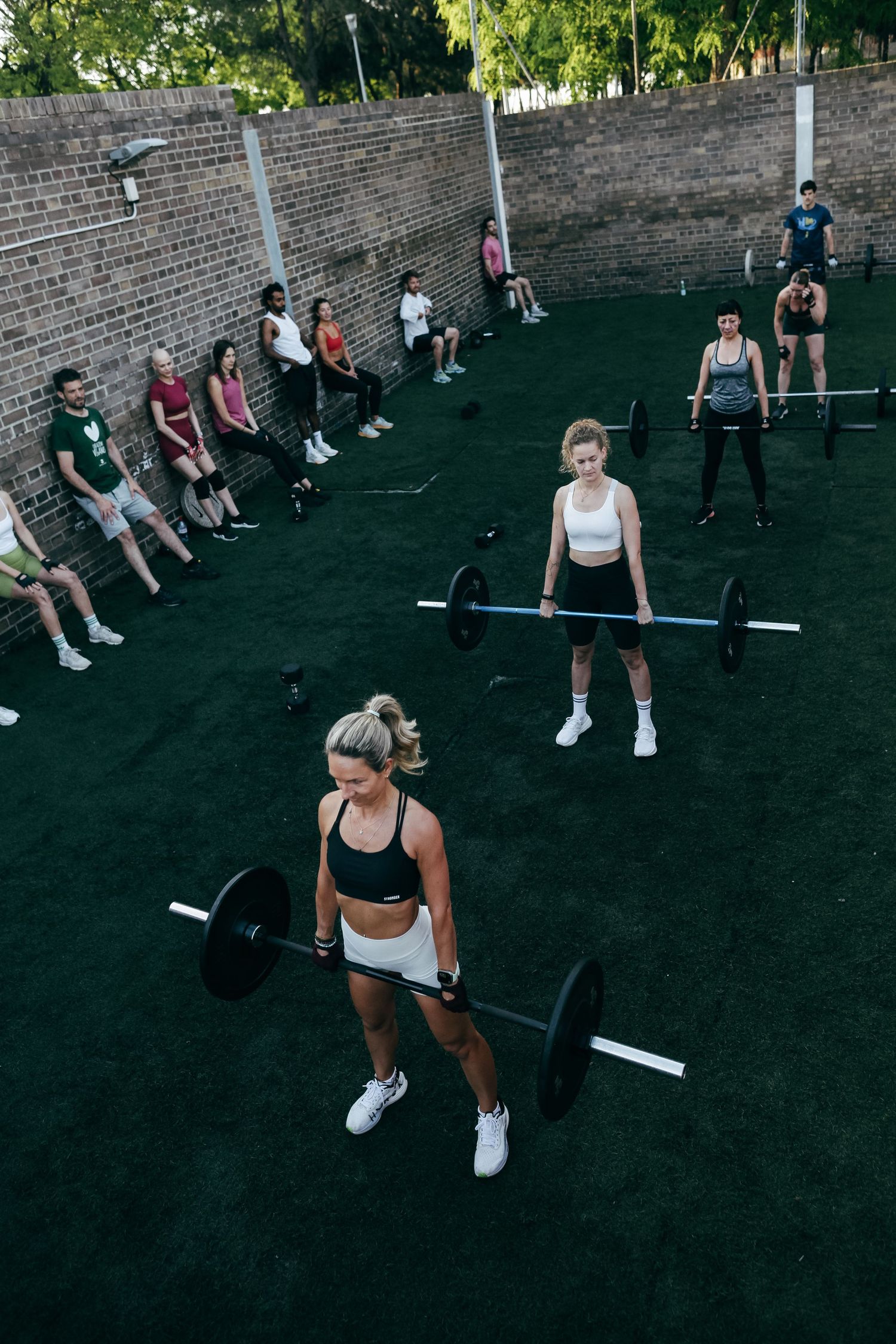 Group fitness class doing deadlift