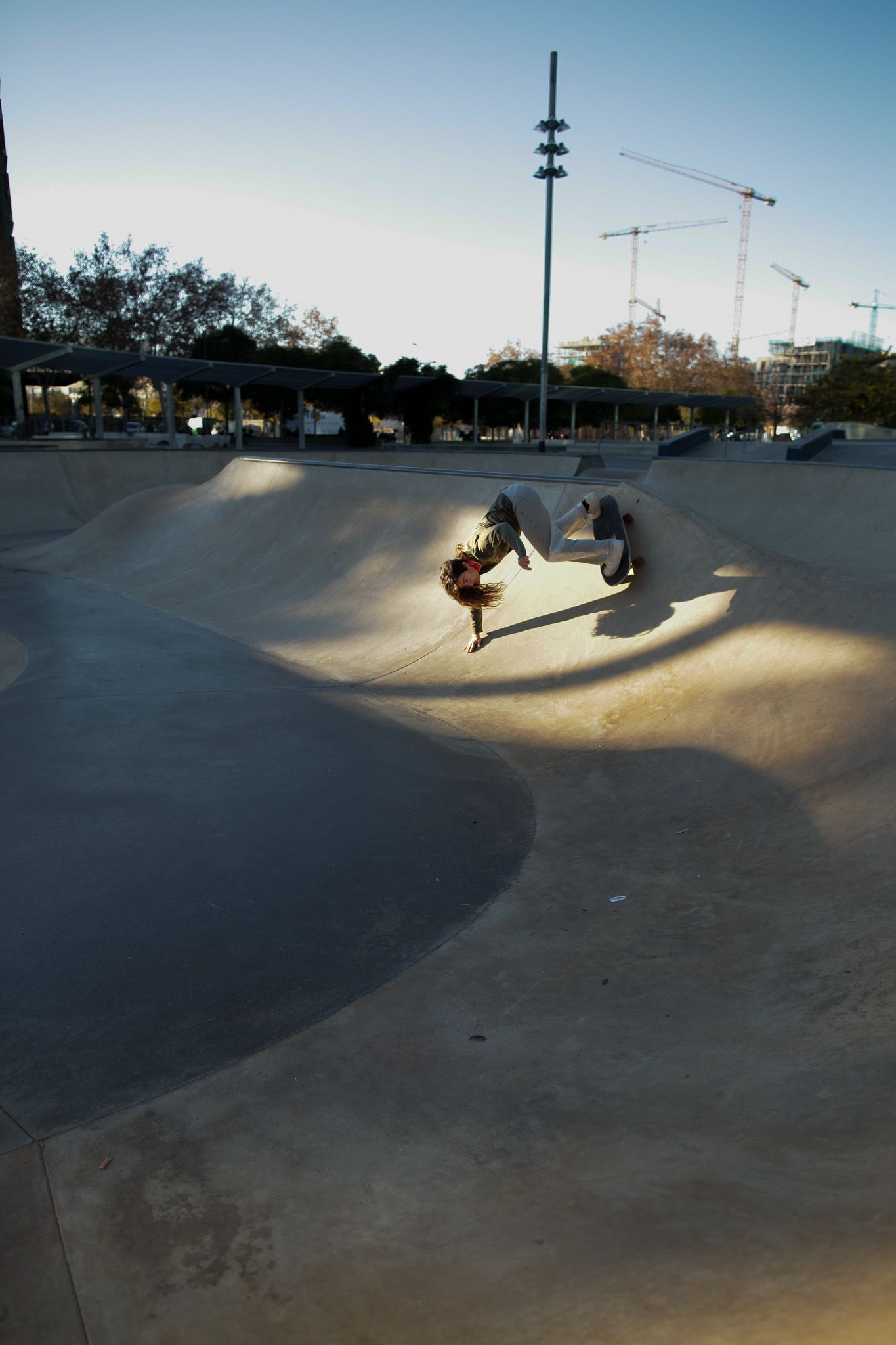 someone performing a skate trick during the sunrise