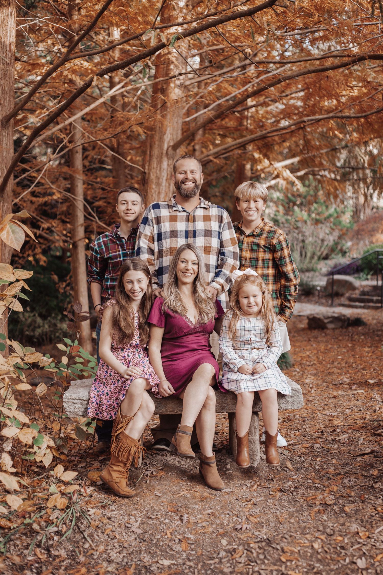 Family photography for a family of six, posing in an autumn fall photoshoot in the upstate of south carolina.