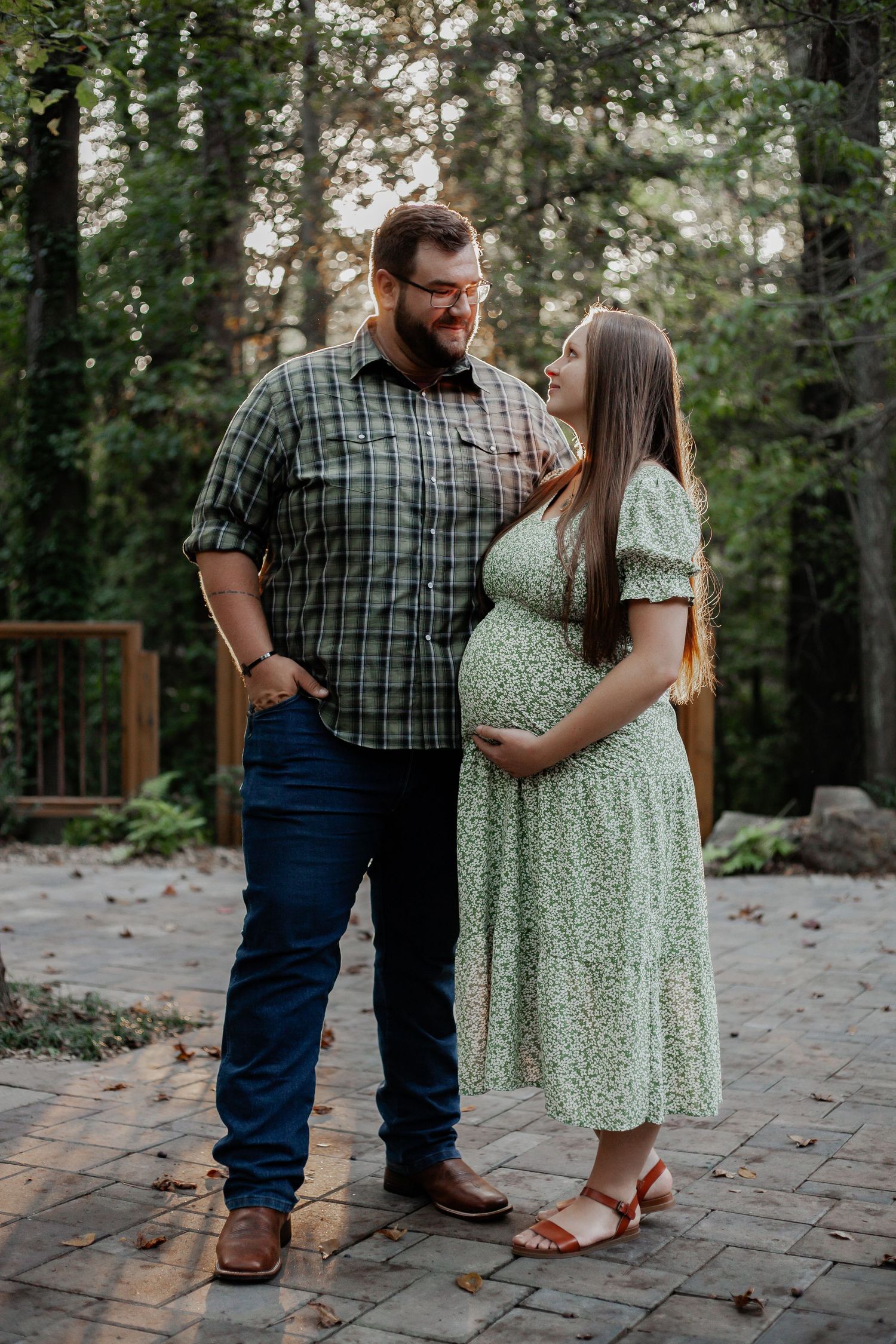 young couple photo shoot holding each other close in wooded forest in south carolina spartanburg