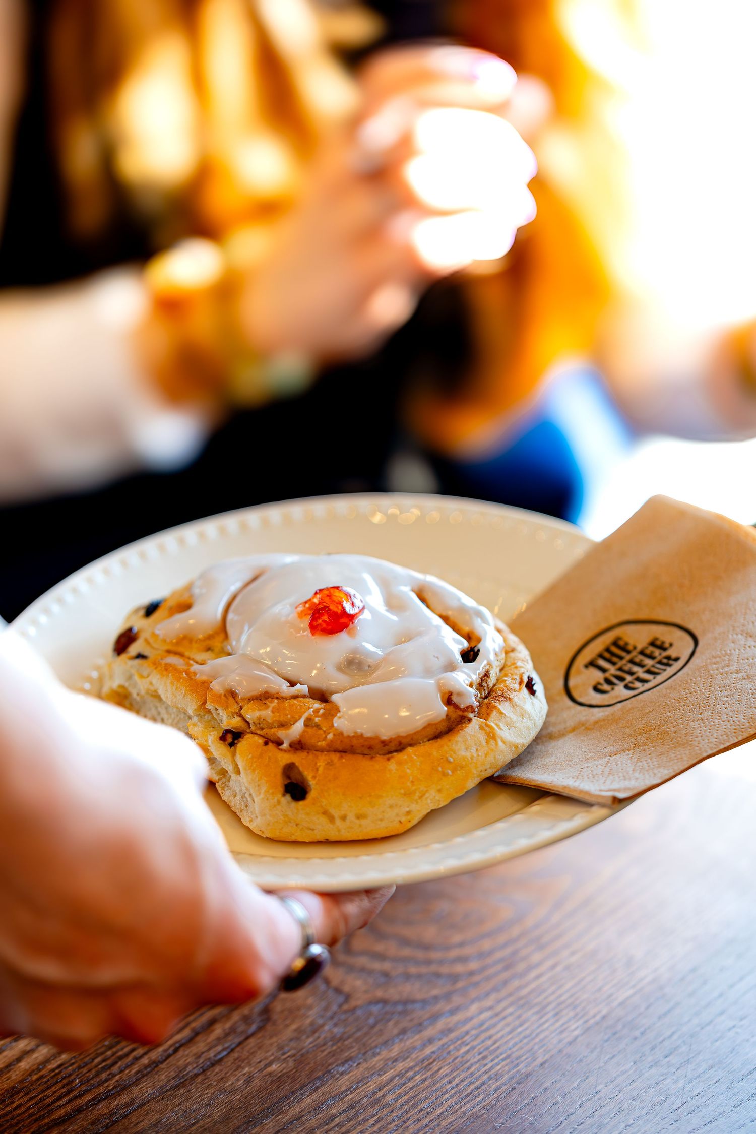 Lifestyle content photography of a pastry being served to a customer at a cafe in Ramsgate Kent.