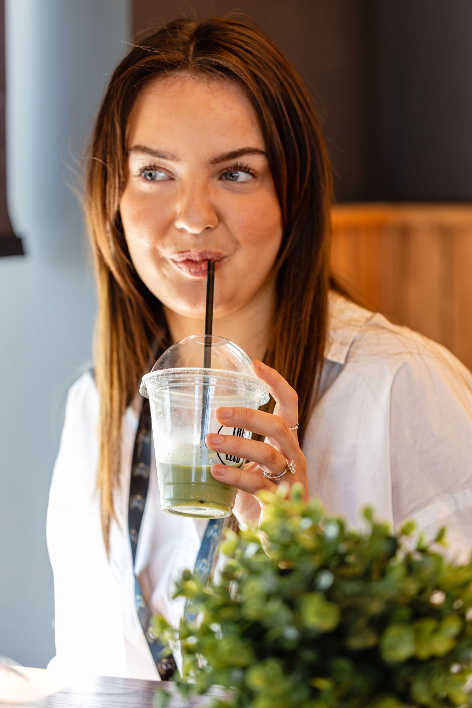 Lifestyle content photography of a female drinking an iced Matcha at a cafe in Ramsgate Kent.