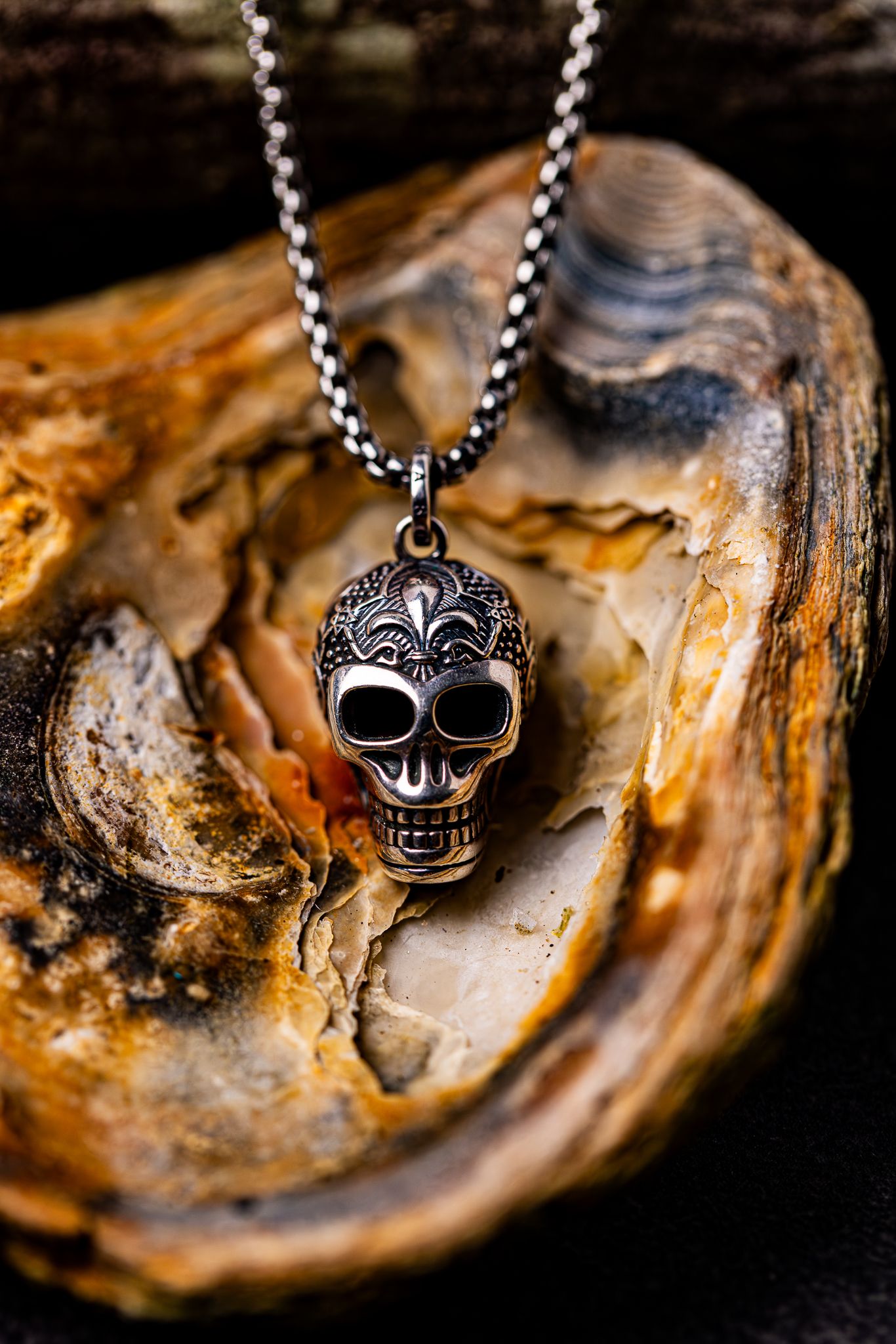 Styled product photography of a pre-owned skull necklace. Jewellery photography in East Kent.