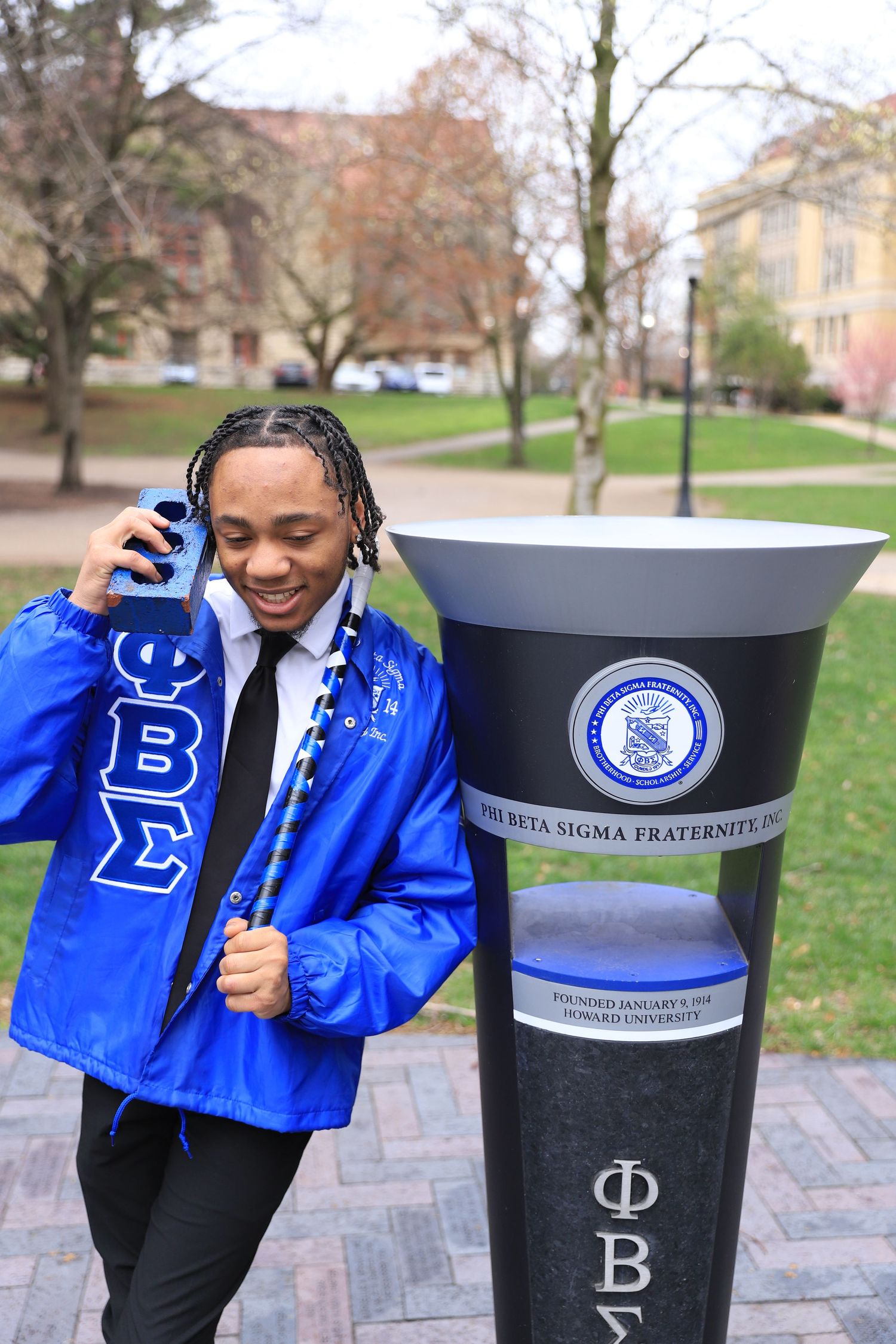 A series of photos showing a person in a blue Phi Beta Sigma jacket posing next to decorative Greek letter pillars outdoors.