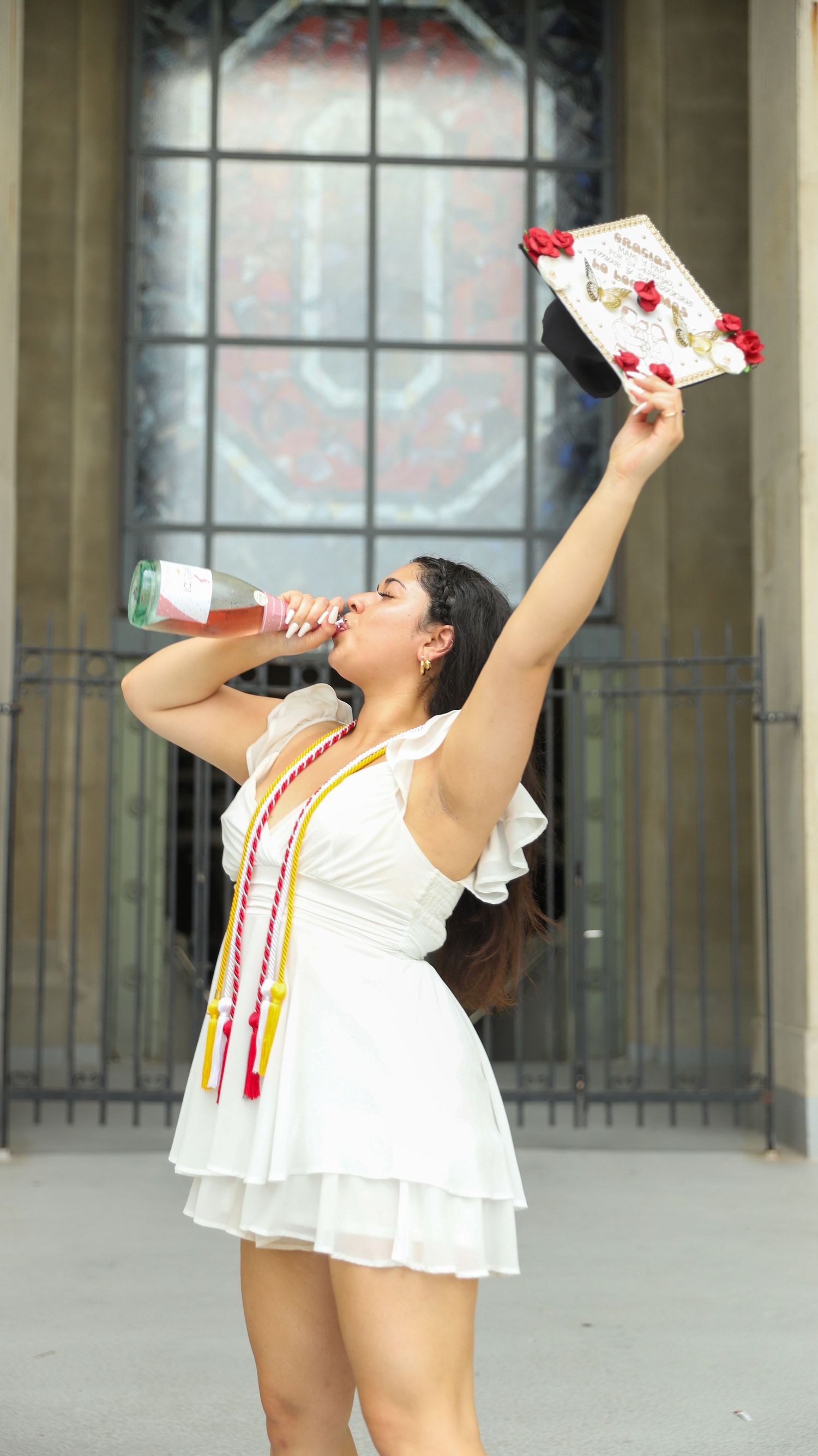 A sequence of photos shows a person in a white dress performing a dance routine with red and white props.