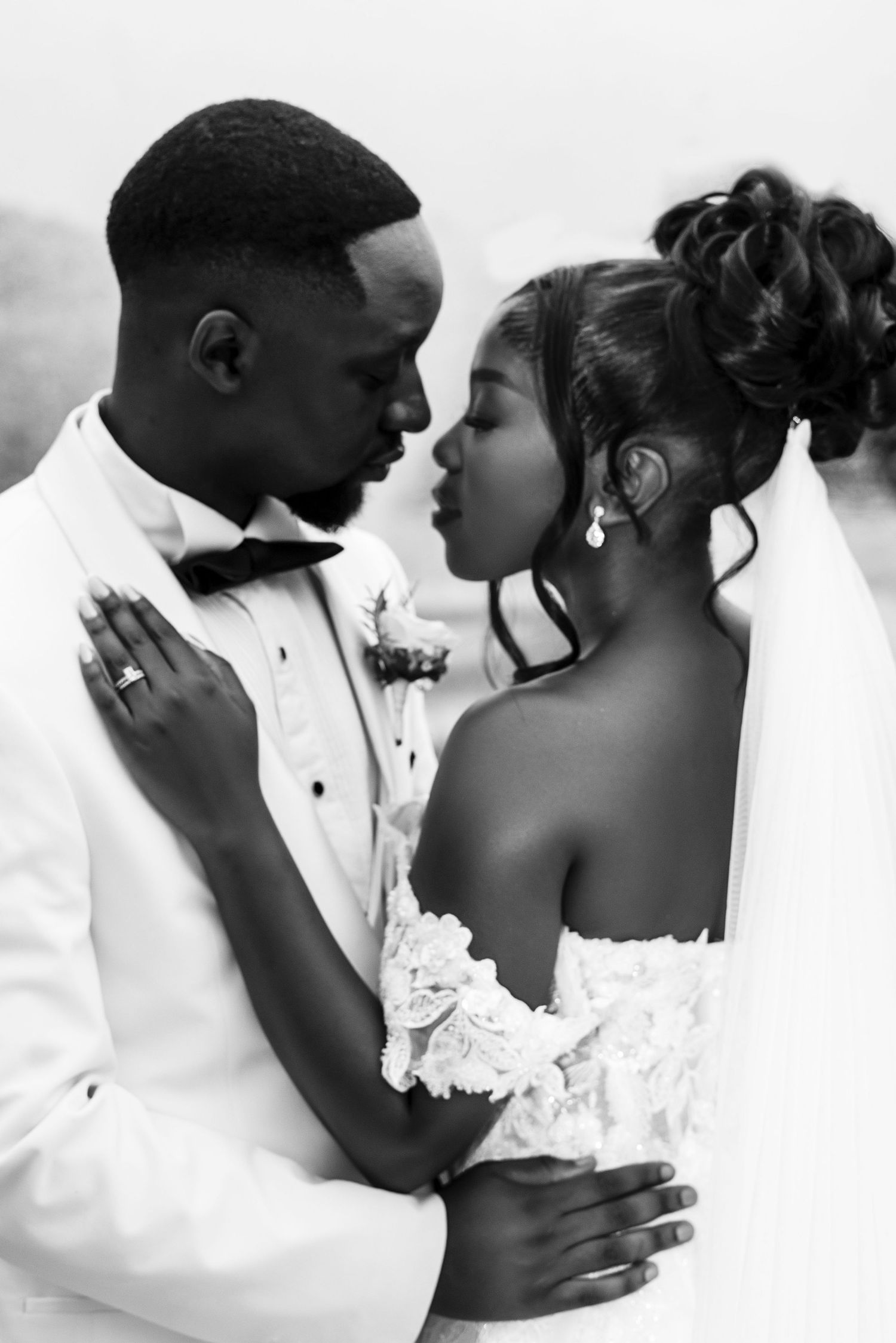 Intimate black and white wedding portraits showing tender moments.