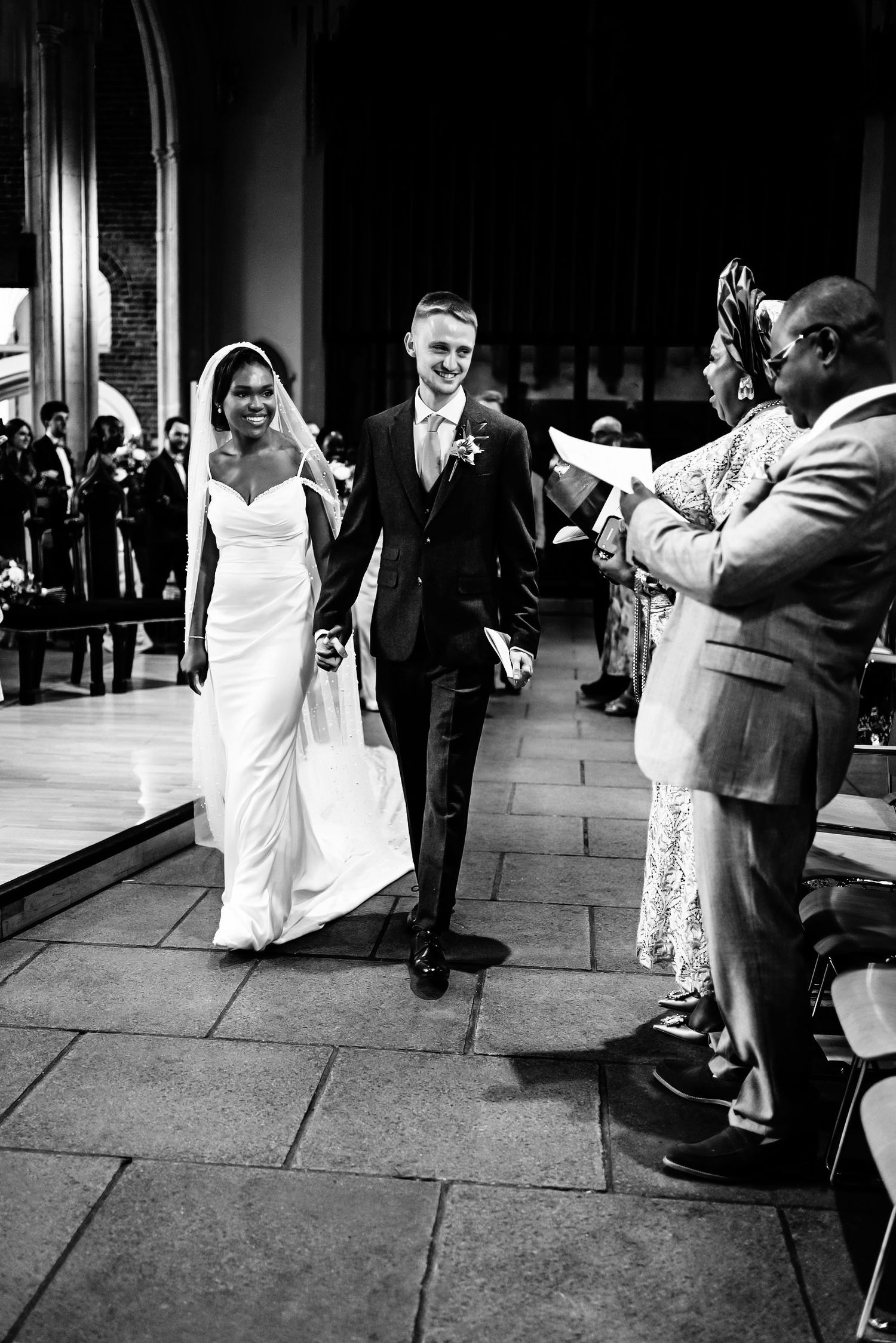 Black and white wedding photos showing dancing and celebration on city sidewalk.