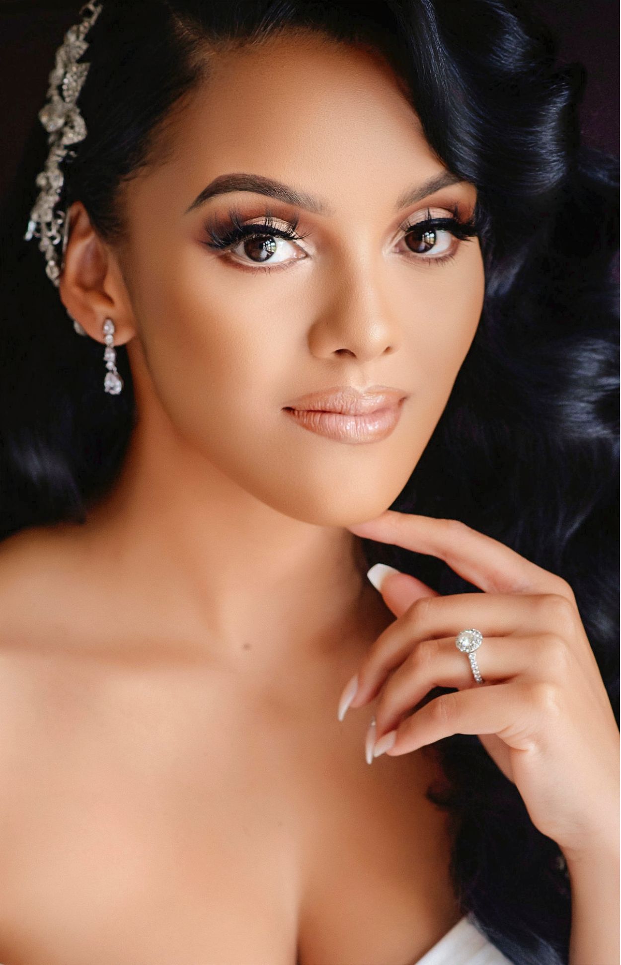 Glamorous bridal portrait series showing elegant makeup and jewelry against soft lighting.