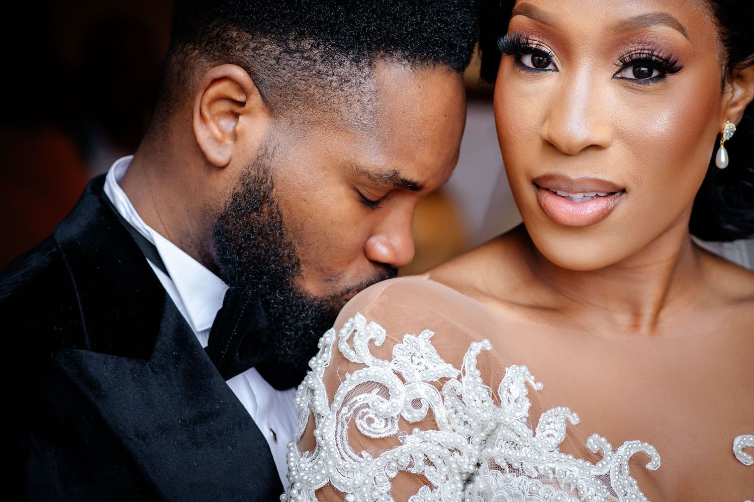 Intimate wedding couple portraits showing tender moments in formal attire.