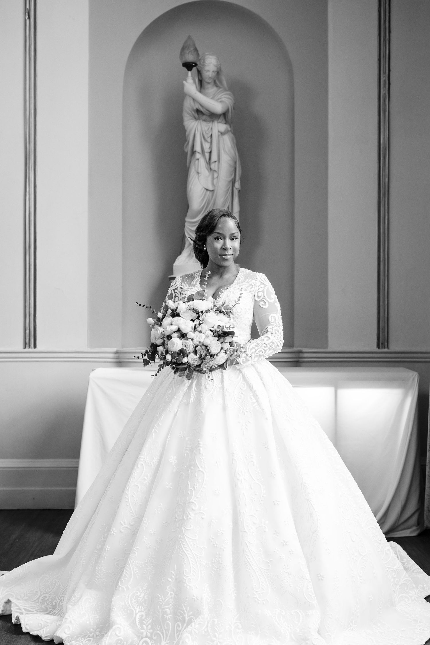 Elegant bridal portraits in black and white with classical architectural elements.