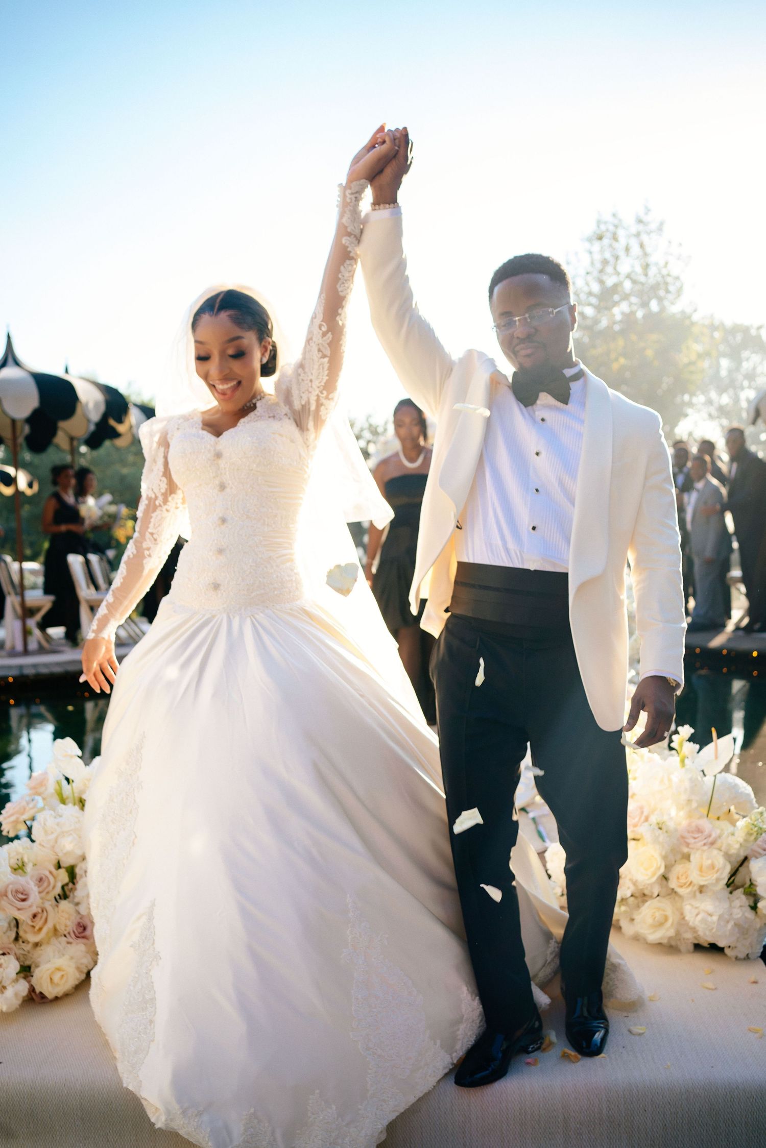 Wedding reception dance sequence showing couple in white dress and black suit.