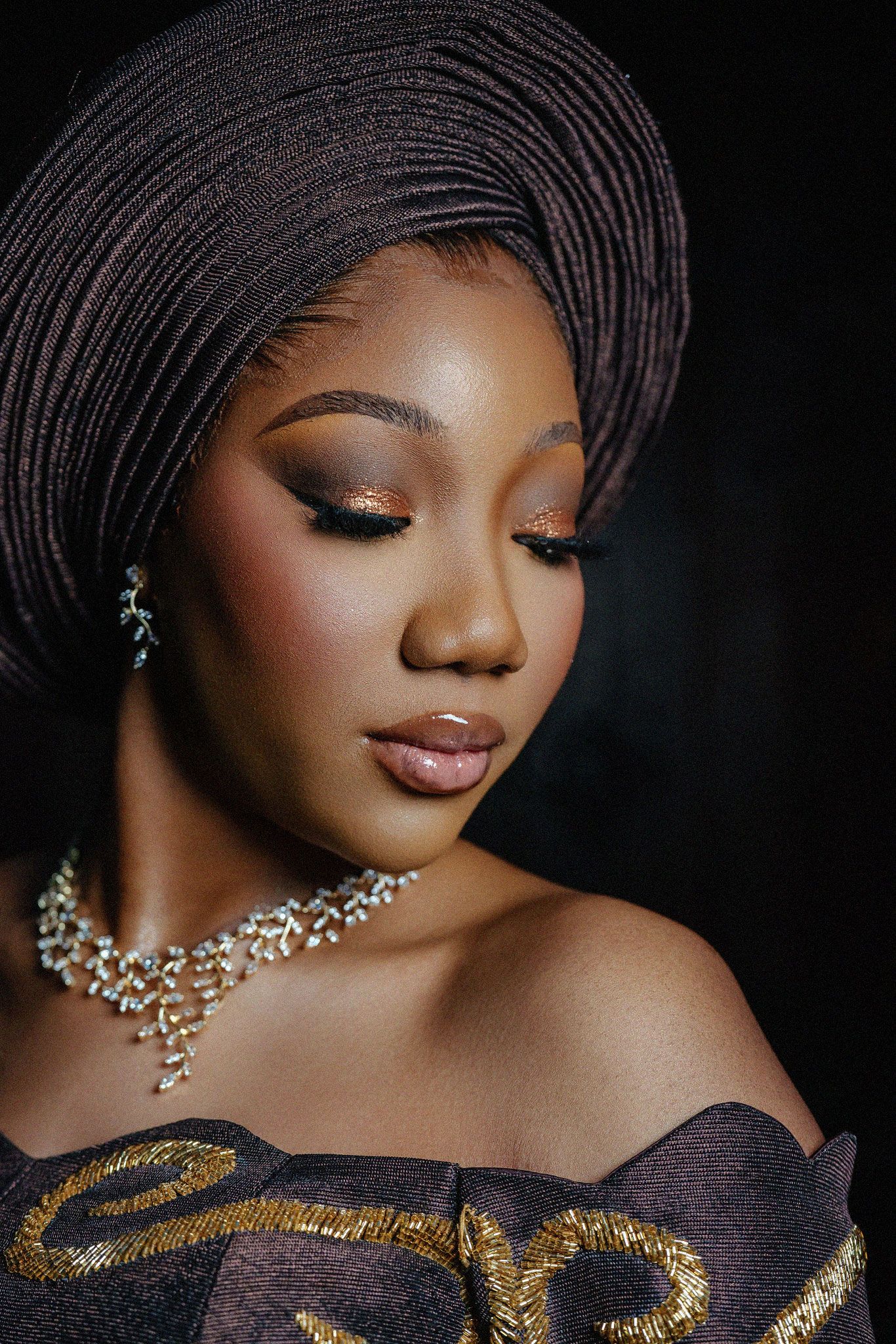 Glamorous portrait series featuring black and gold evening wear with sparkling jewelry.