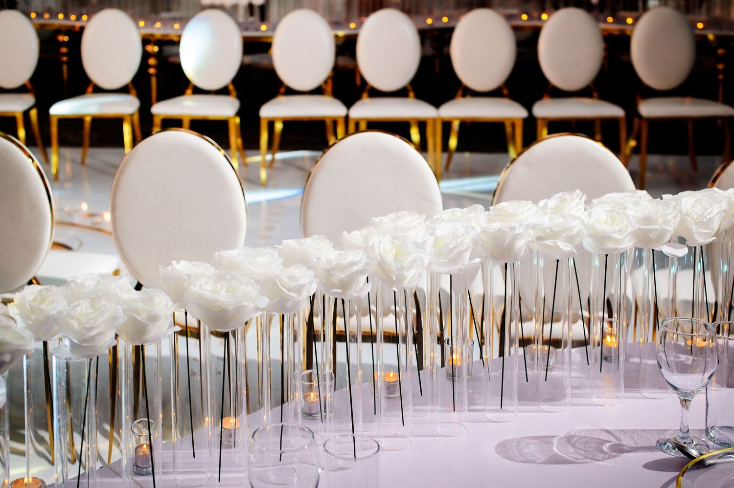 Row of white balloons create an elegant wedding reception decoration display.