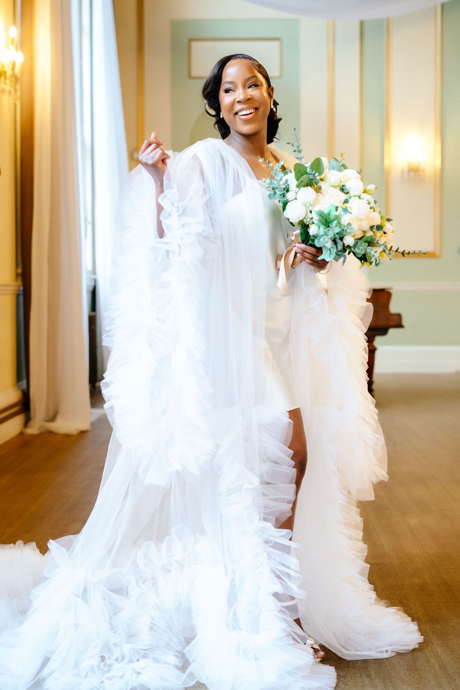 Elegant white wedding dress with flowing train captured in sequence across a bright hallway.