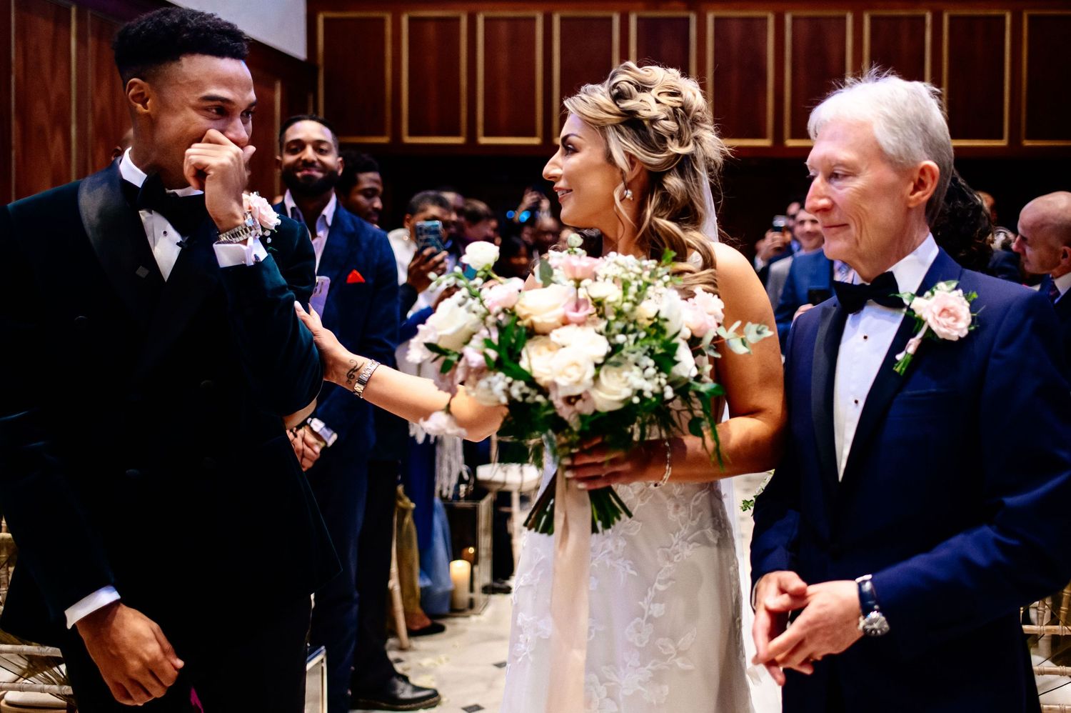 Wedding party celebrates joyfully in a traditional church setting during an elegant ceremony.