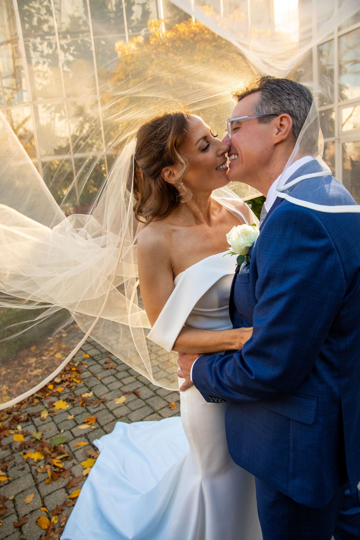 Civic Gardens Venue in London, Ontario - A beautiful couple spending some time on the patio together after the ceremony on a fall evening.
