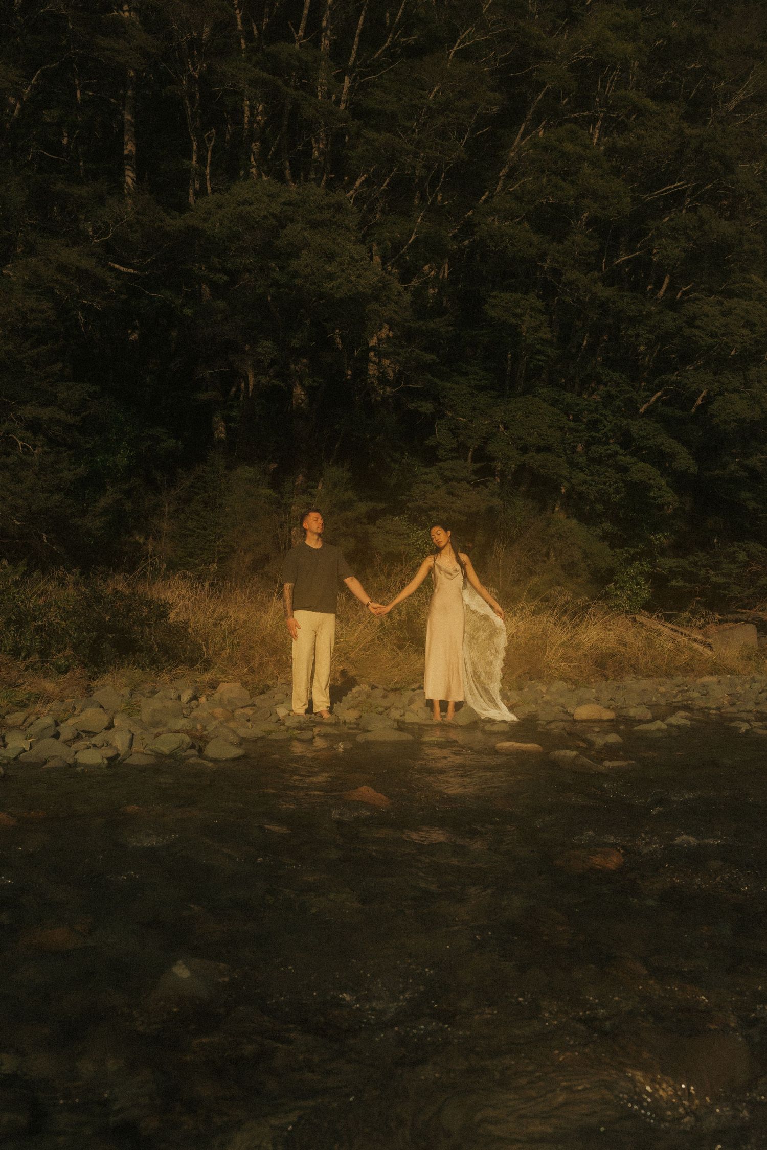 Cinematic photo of couple by river
