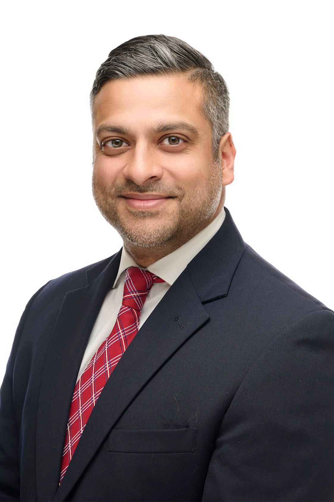 Professional headshot of a man in a navy suit and red tie against a white background.