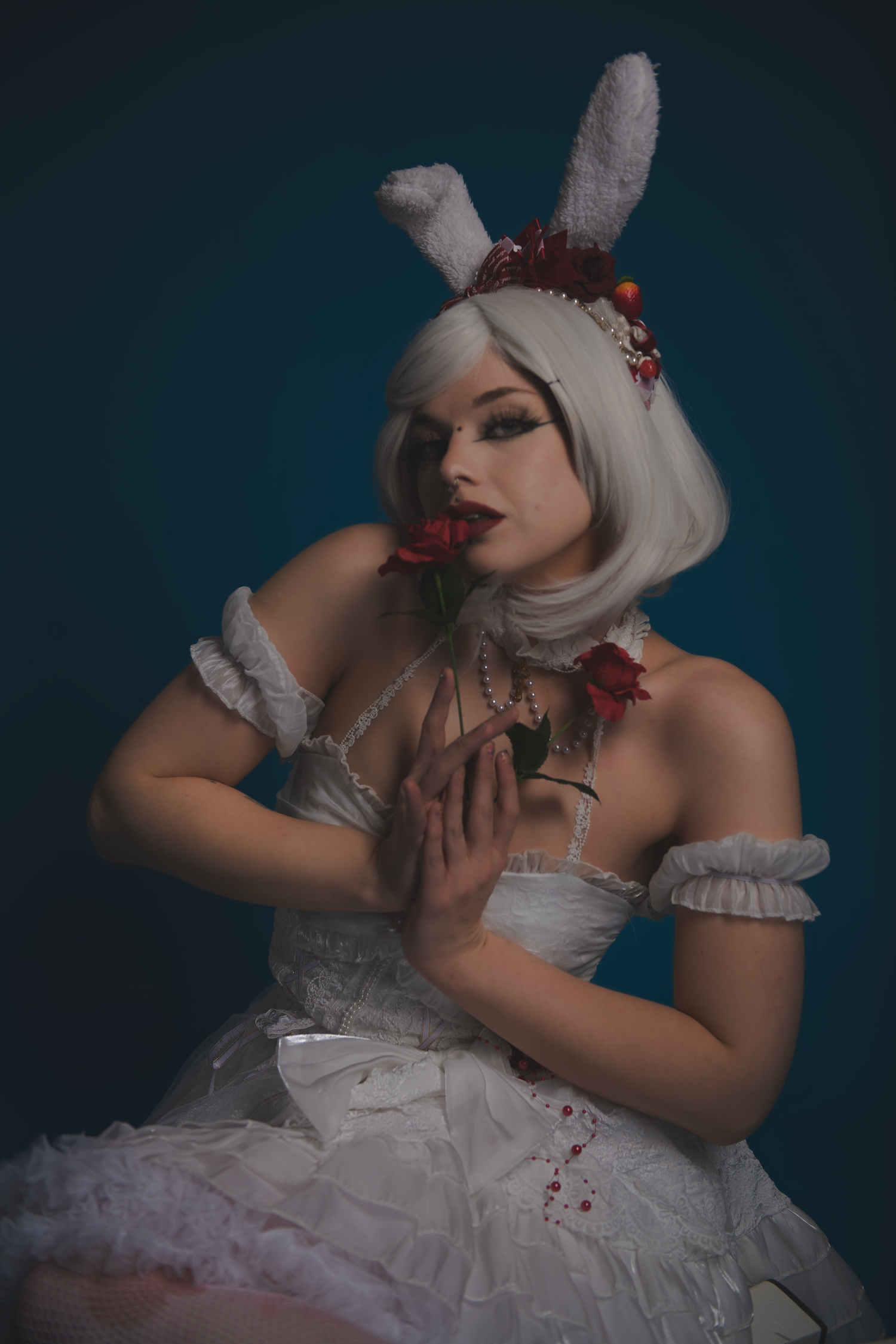 Dramatic fashion shoot featuring white dress and vintage-inspired styling.