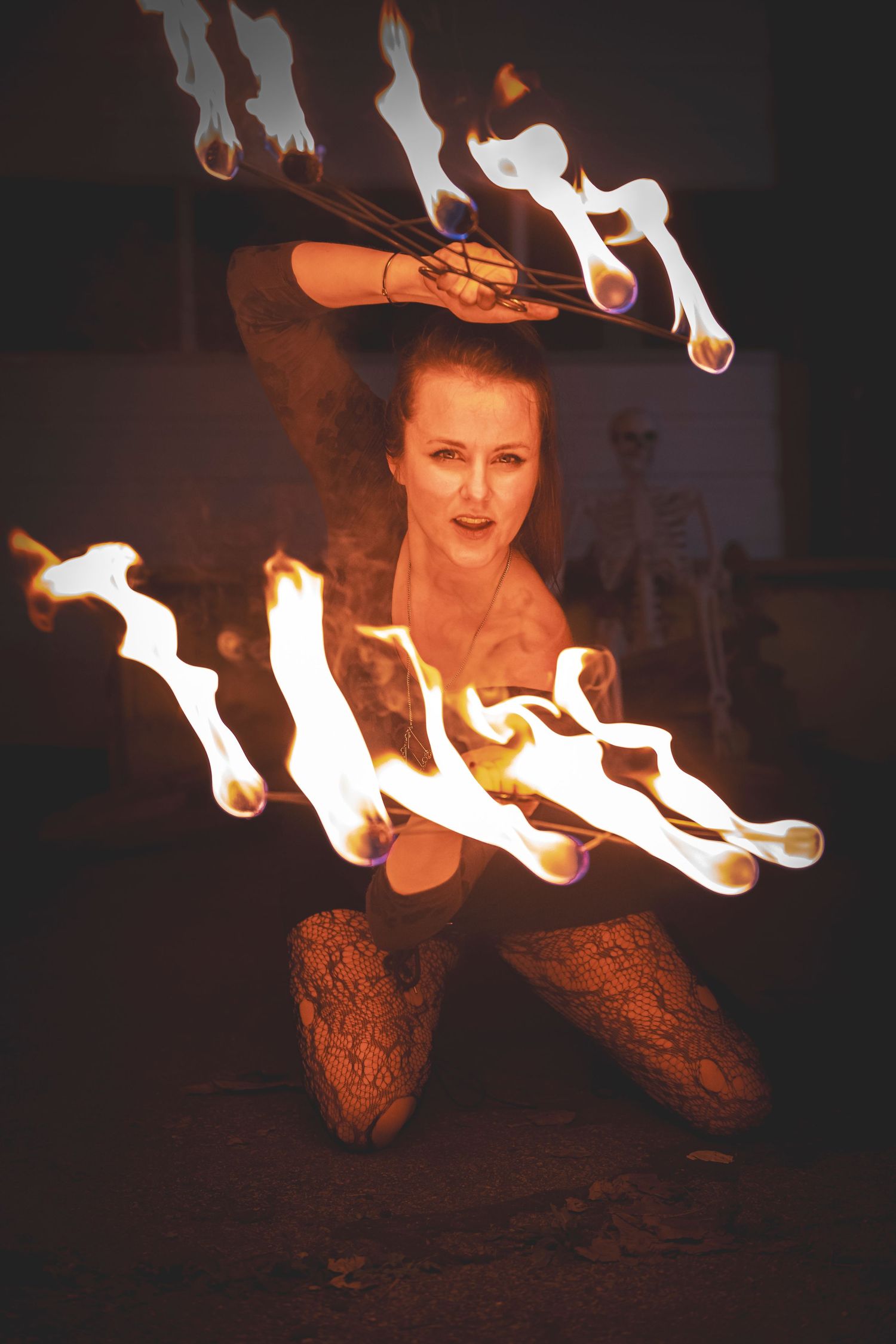 Low angle shot of fire performance showing bright flames against dark background.