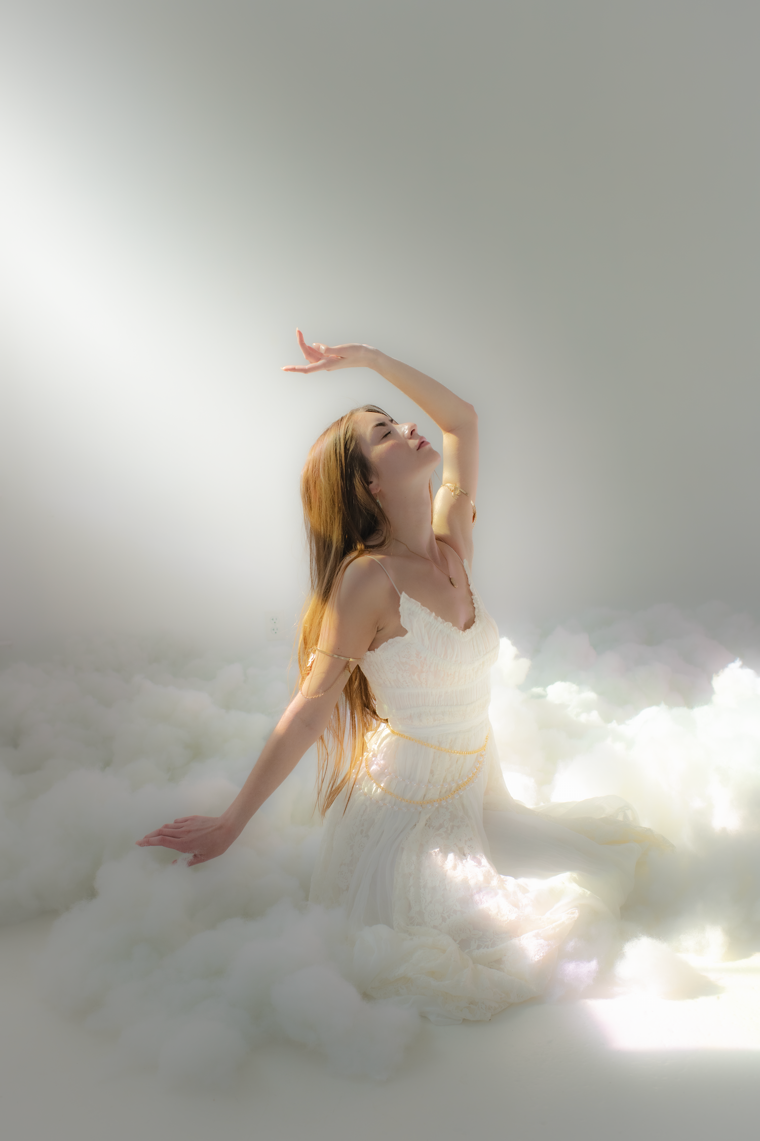 Ethereal figure emerges from soft clouds and light in a dreamy artistic photo sequence.