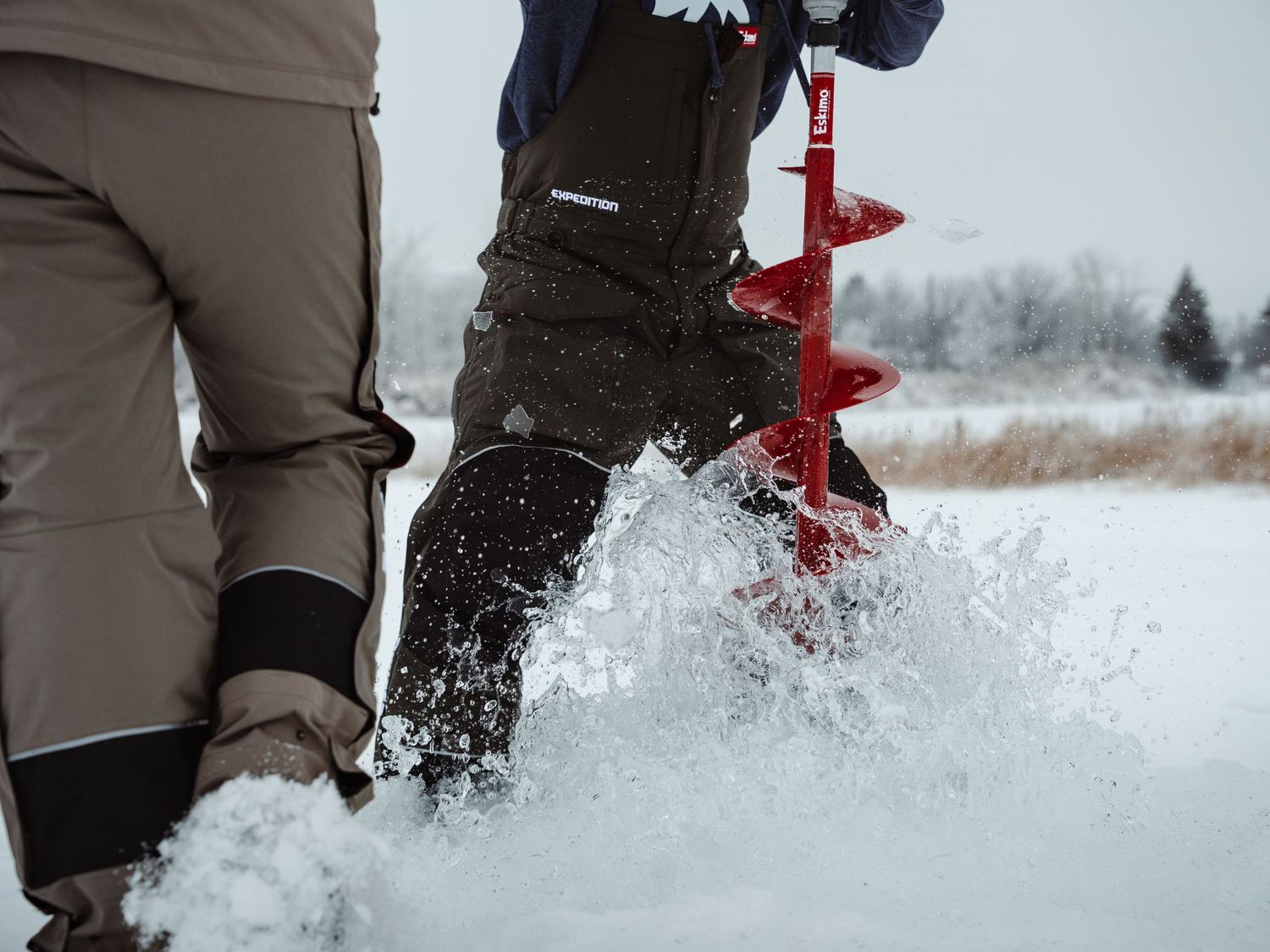 Close-up of snow being kicked up while walking through deep powder.