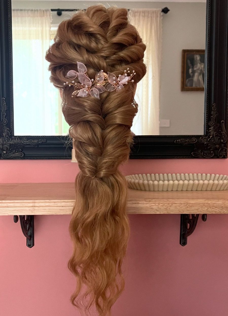 Boho pony textured twists and twirls plaited back into a long pony detailed with a diamond accessory