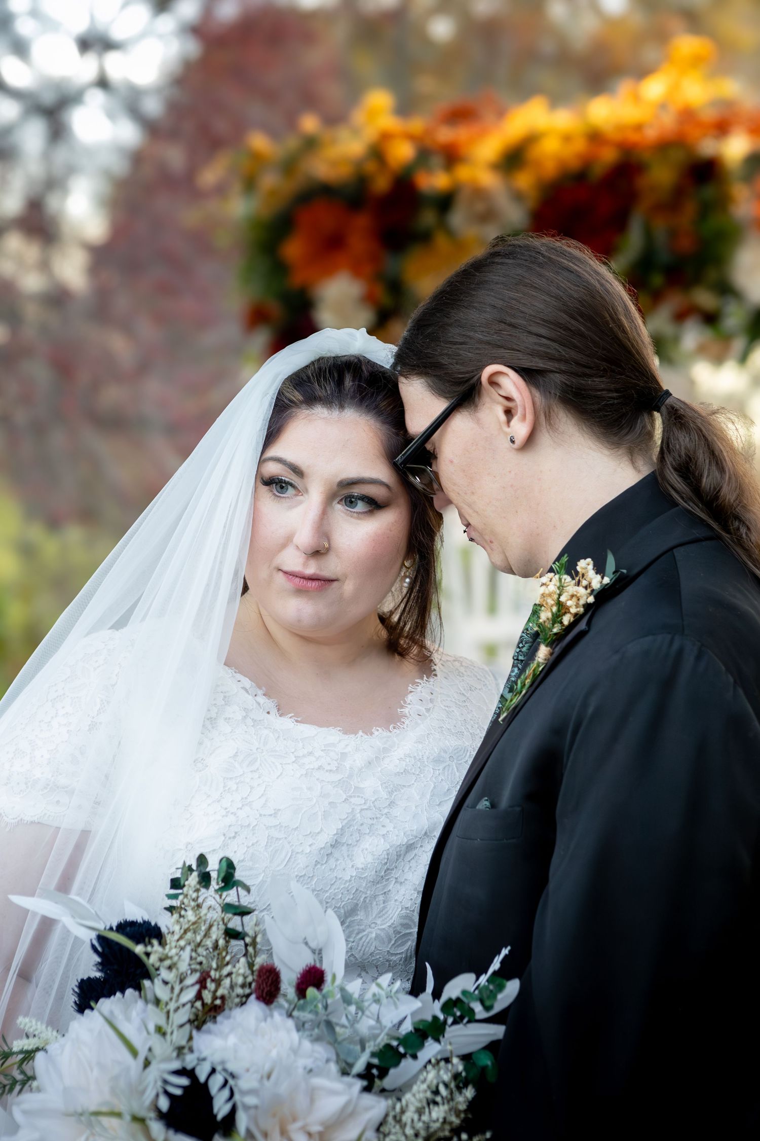 beautiful couple leaning on each other during a wedding in avon indiana at the avon gardens