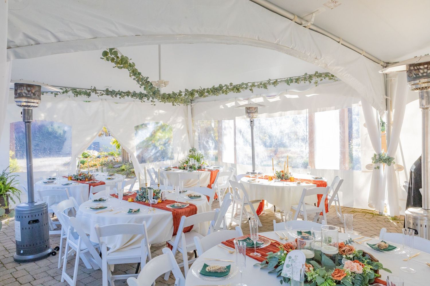 all white tent setup for cocktail hour during a wedding in avon indiana at the avon gardens
